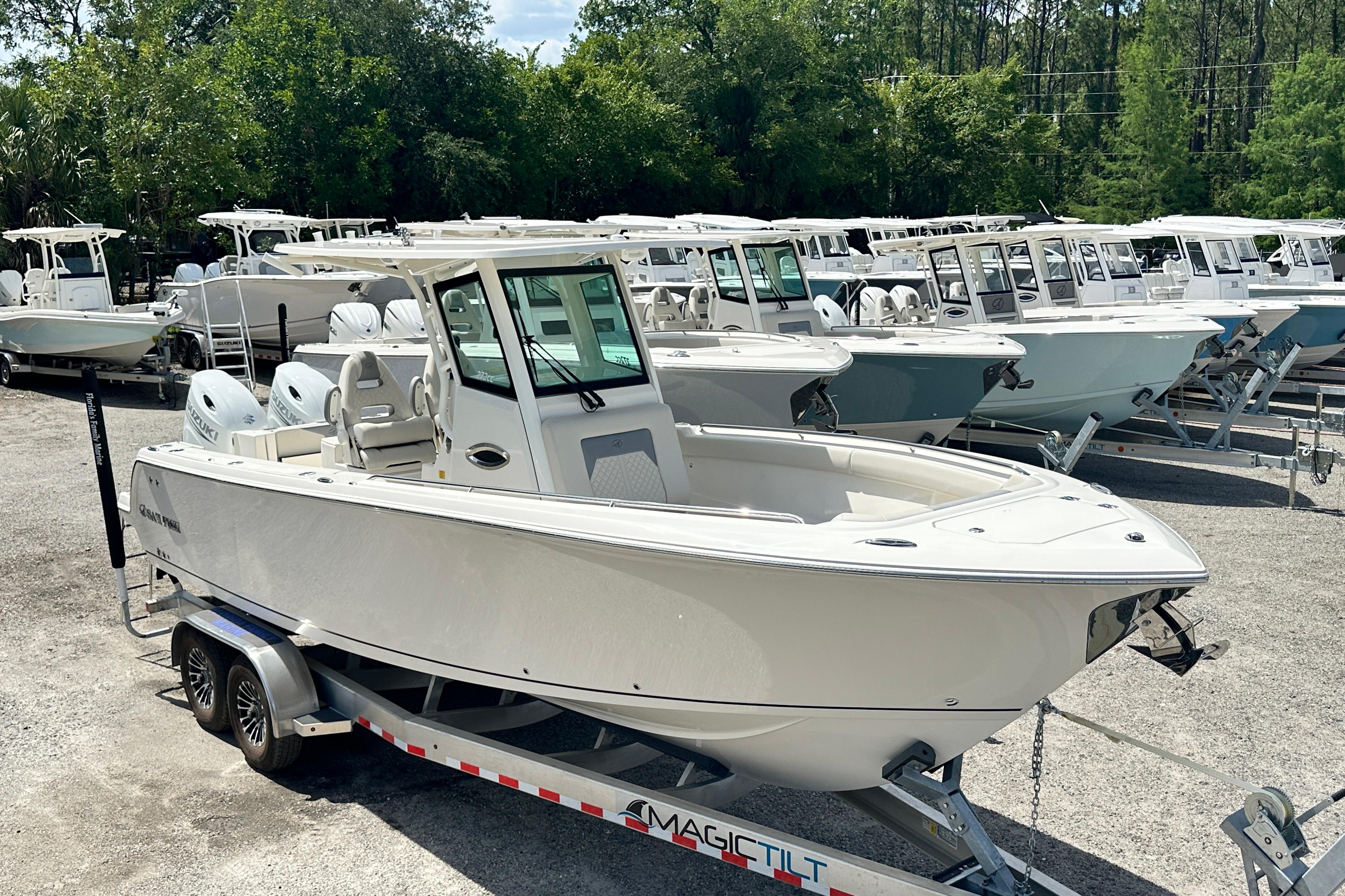 2026 Sailfish 272 CC boat on trailer, surrounded by similar boats in a lot.