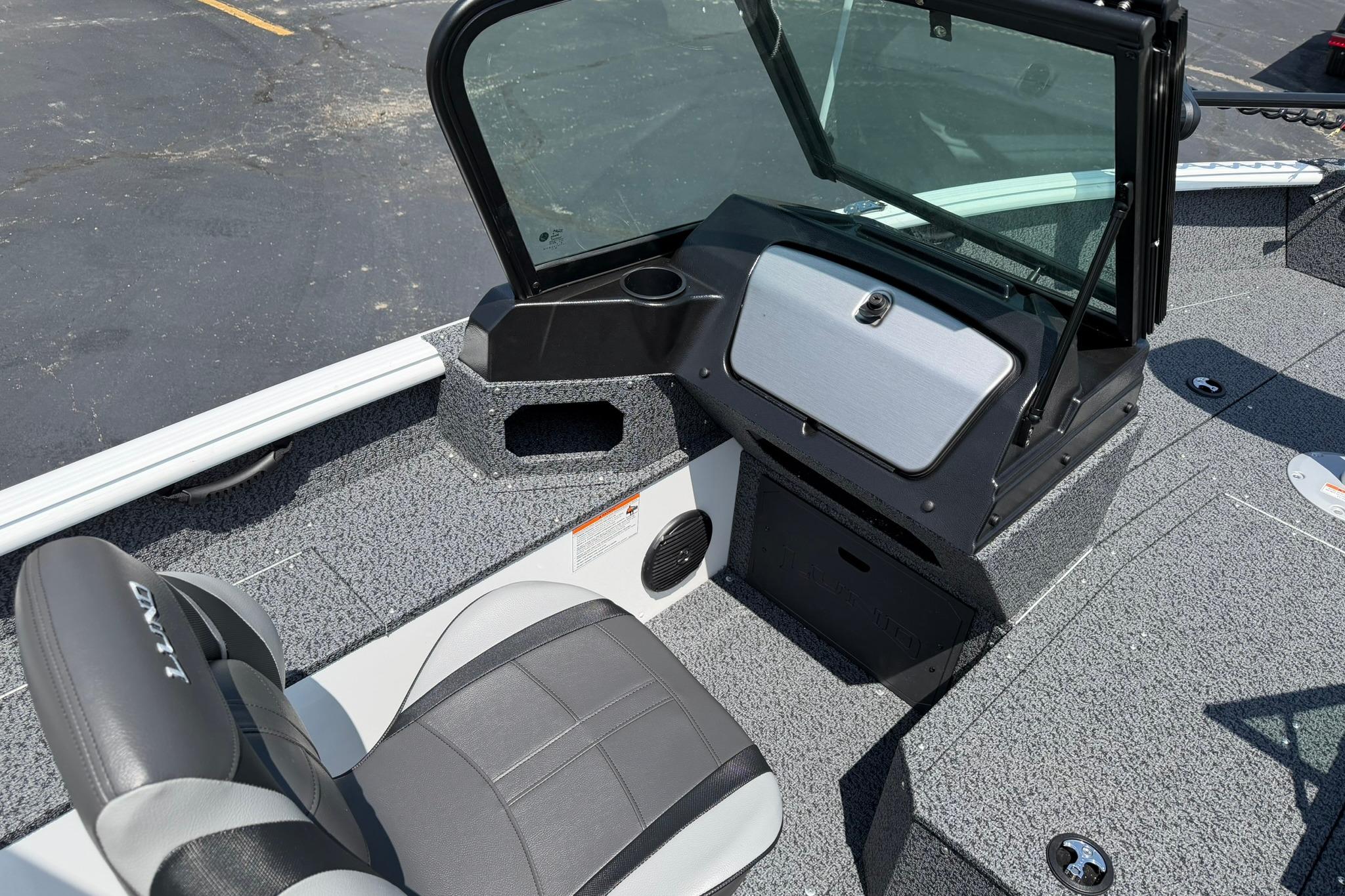 2027 Lund 1675 Adventure Sport boat interior with seating and dashboard view.