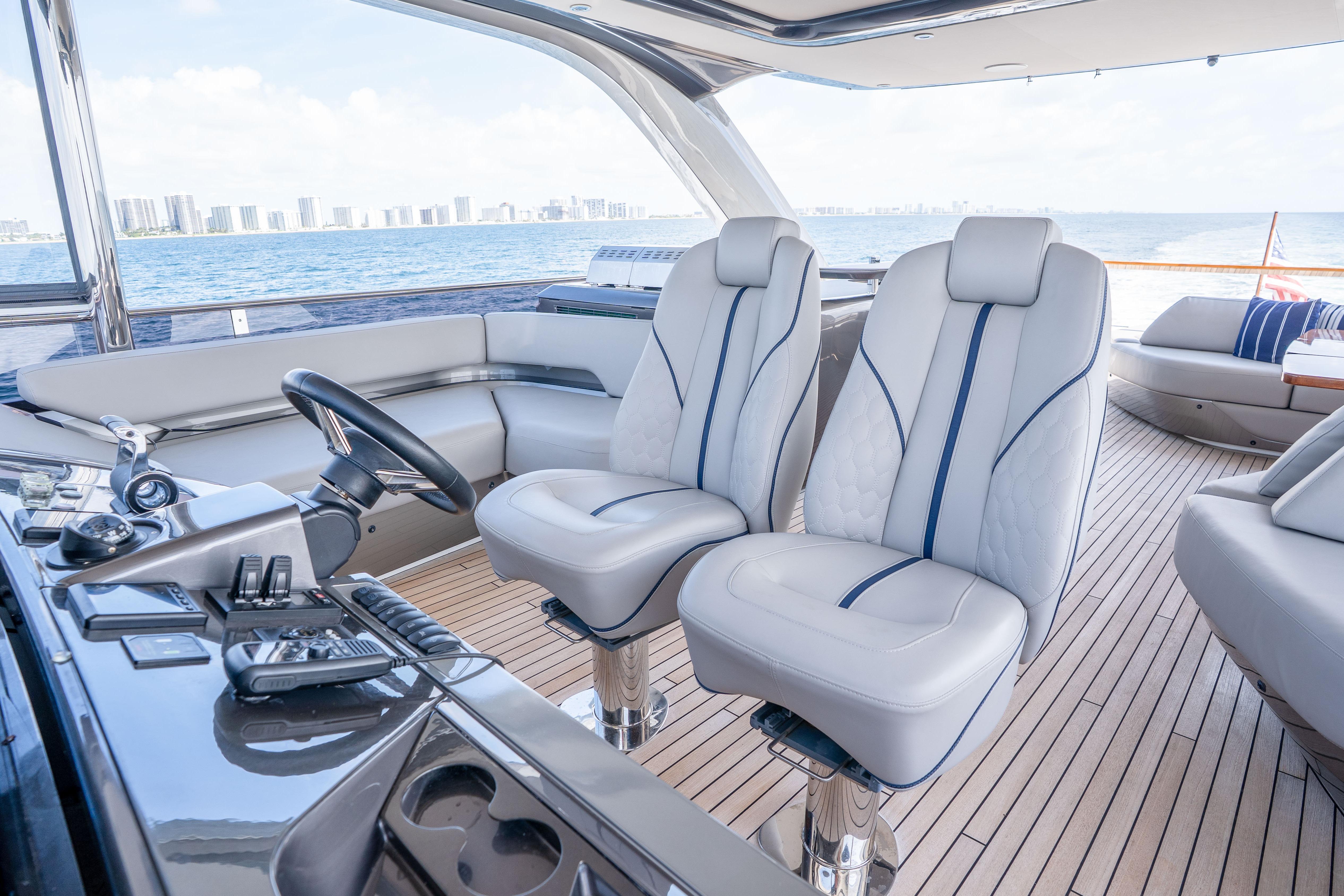 Luxurious 2020 Princess Y85 yacht interior with modern helm and plush seating.