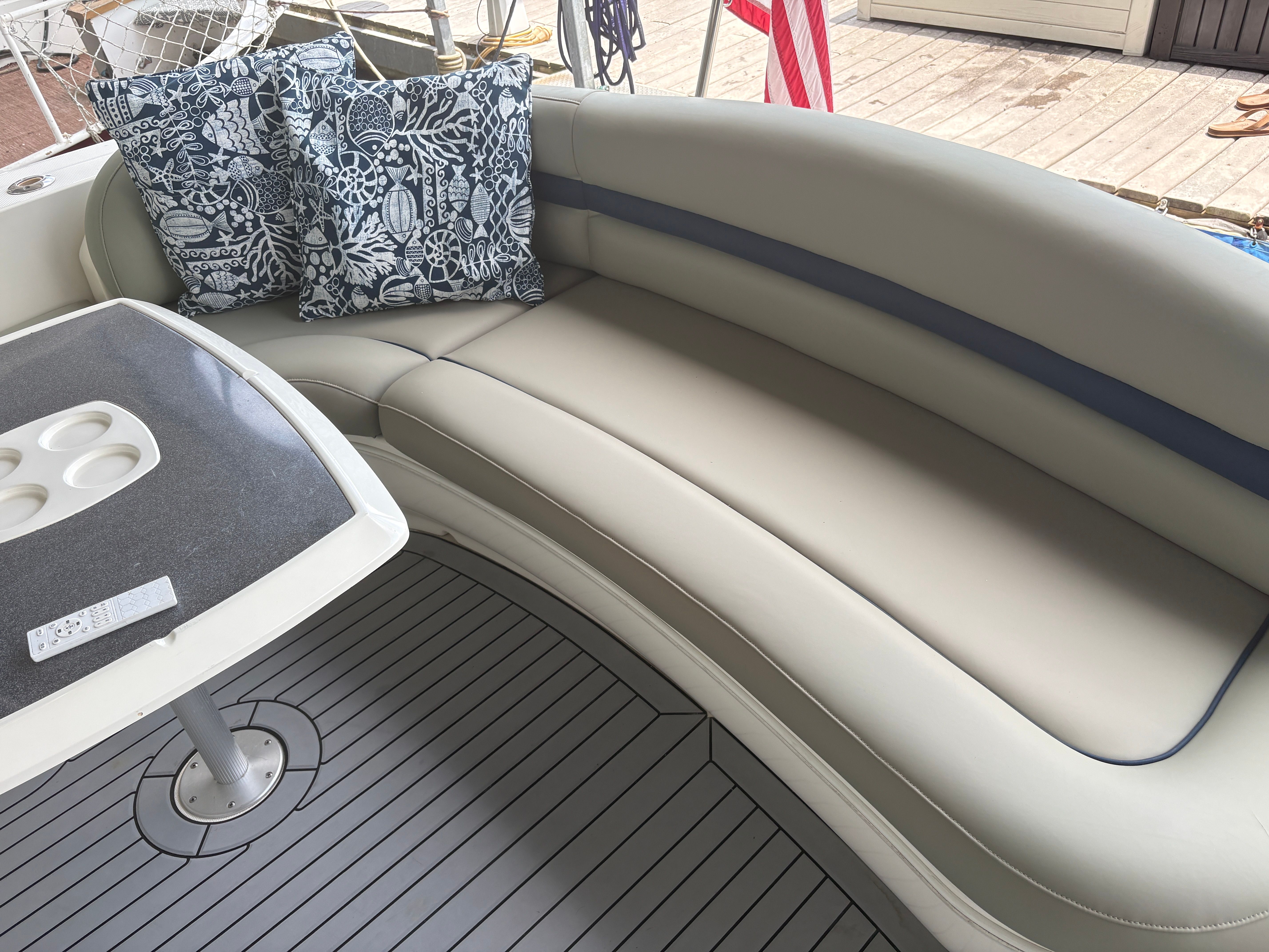 Interior of a 2005 Sea Ray 420 Sundancer yacht with seating and table.