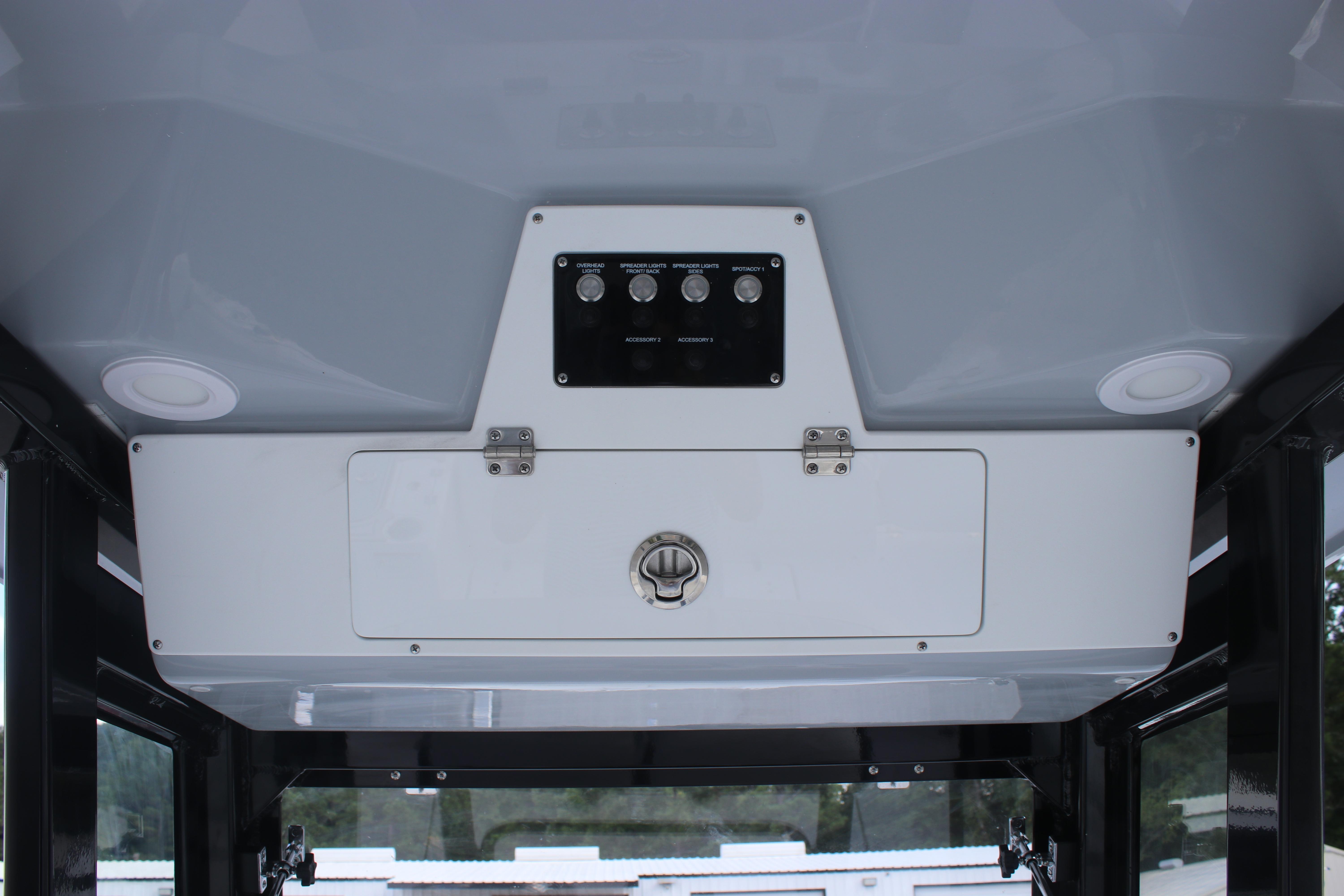 2026 Sea Fox 268 Commander boat console with control panel and storage compartment.