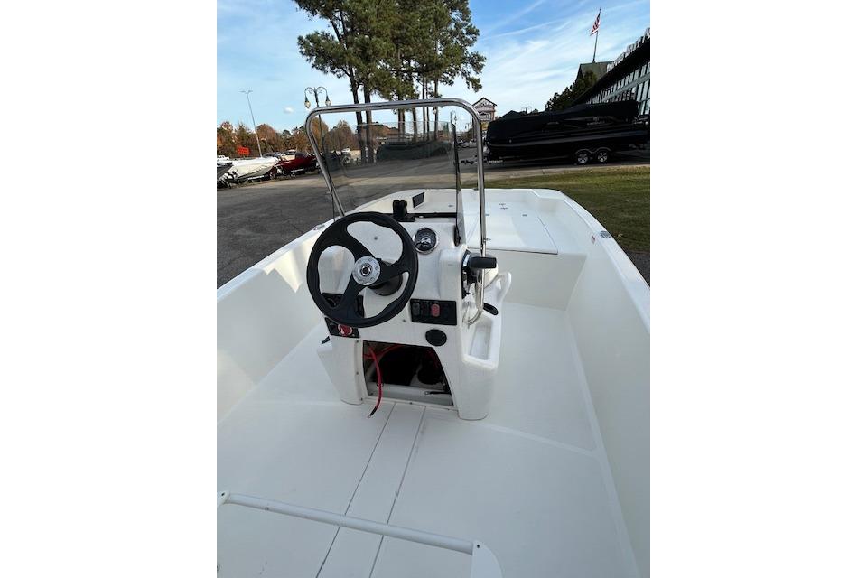 2025 Mako Pro Skiff 17 CC boat interior with steering console and controls.