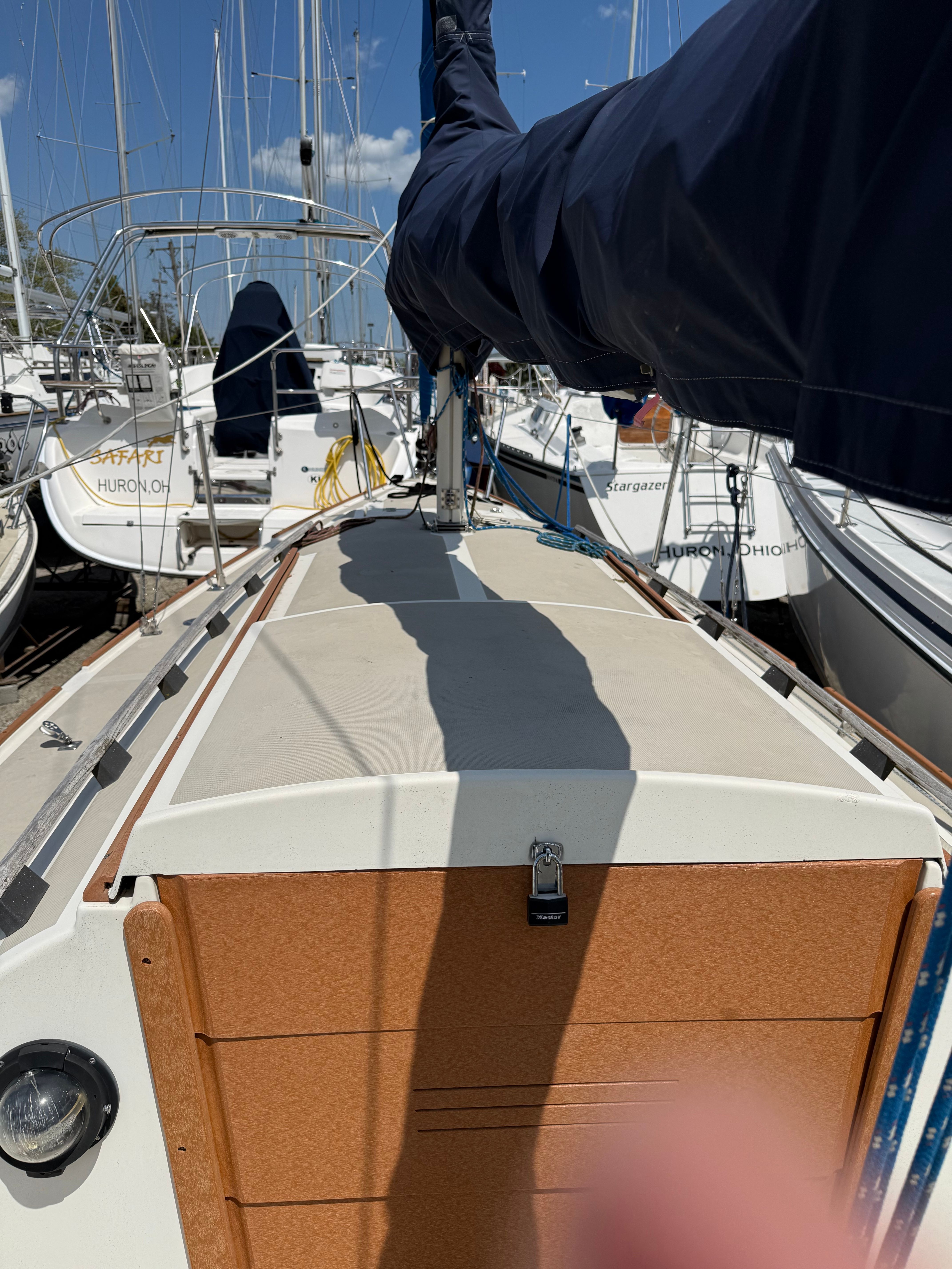 1984 O'Day 25 sailboat docked, sunny day.