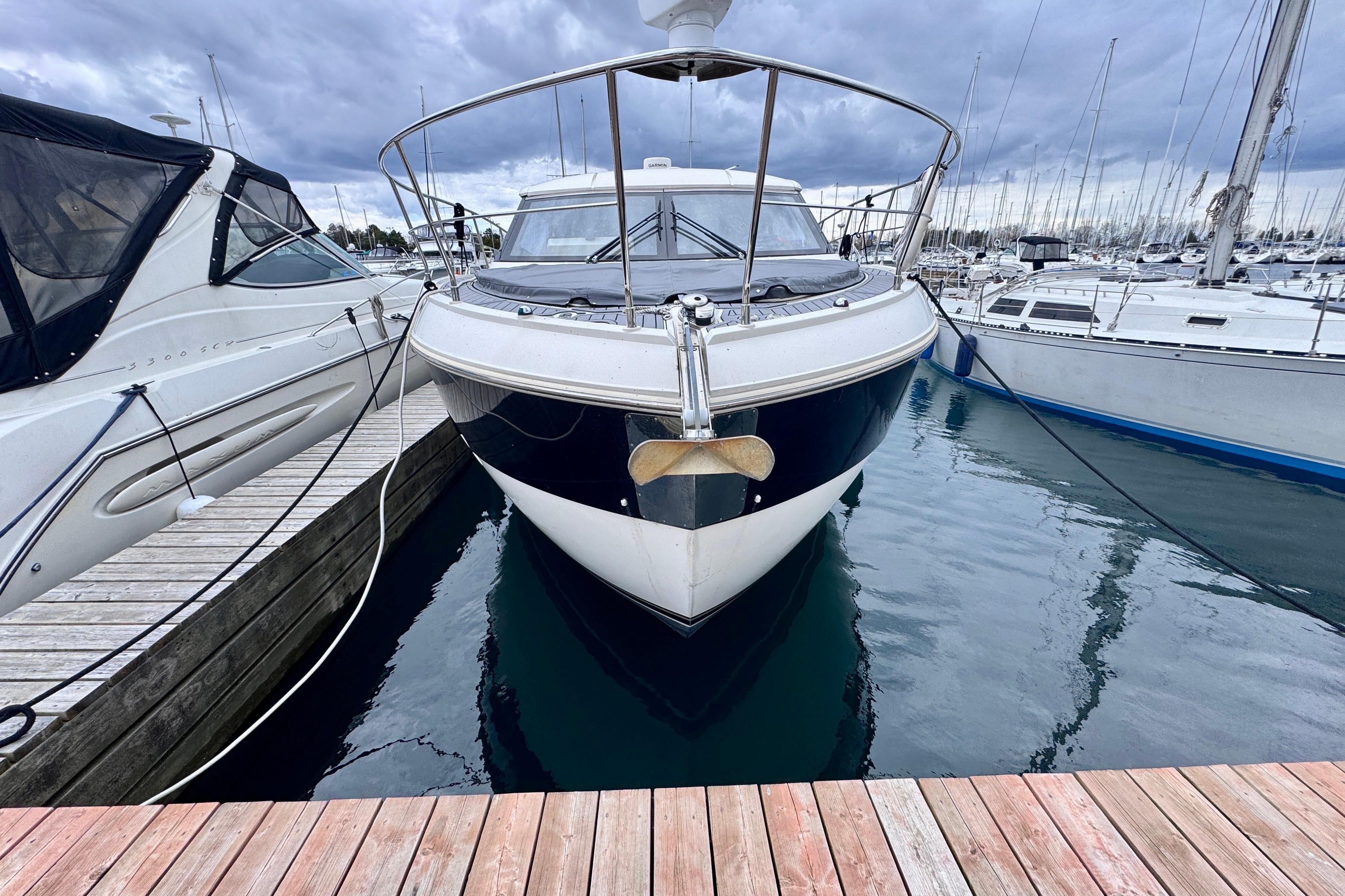 Carver C37 yacht docked at marina, cloudy sky, 2015 model.