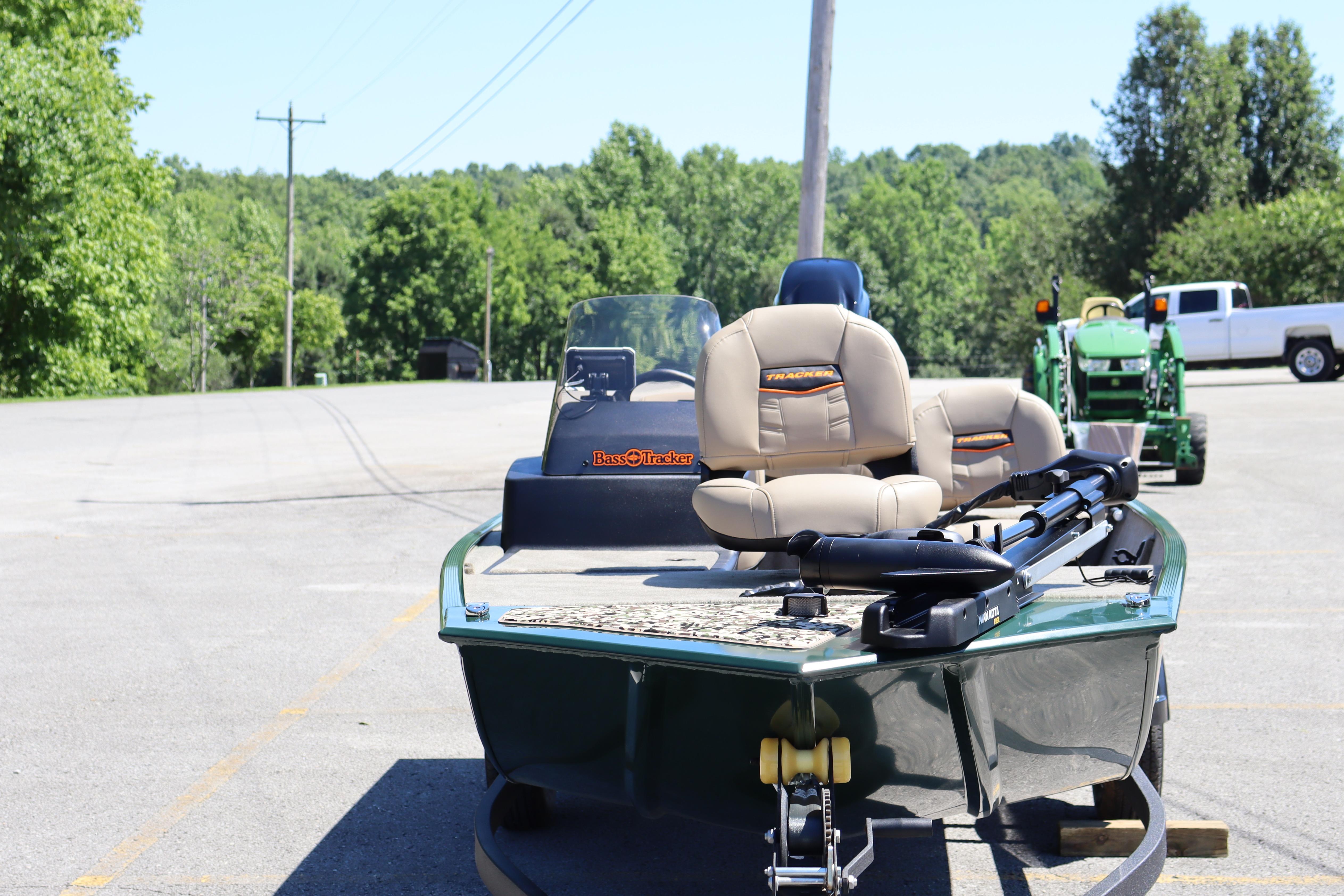 2026 Tracker Bass Tracker Classic Limited boat parked outdoors on a sunny day.