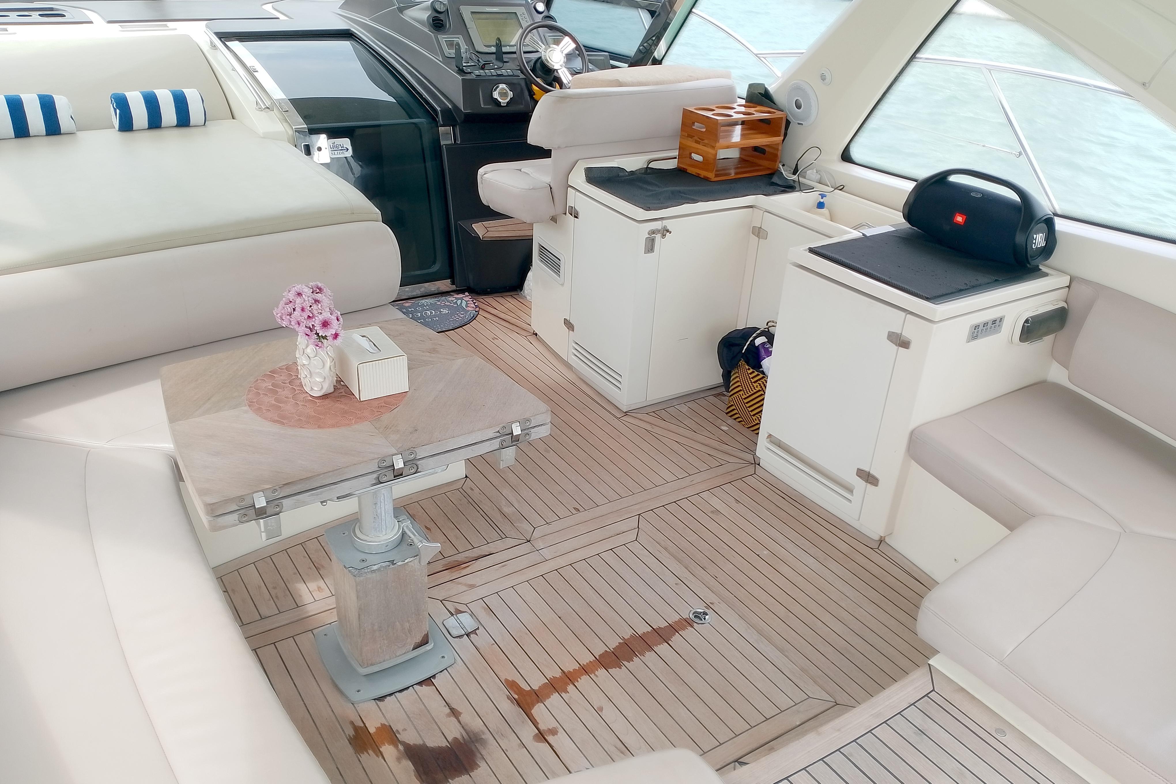 Luxurious interior of 2007 Azimut Atlantis 50 yacht with elegant seating and wooden flooring.