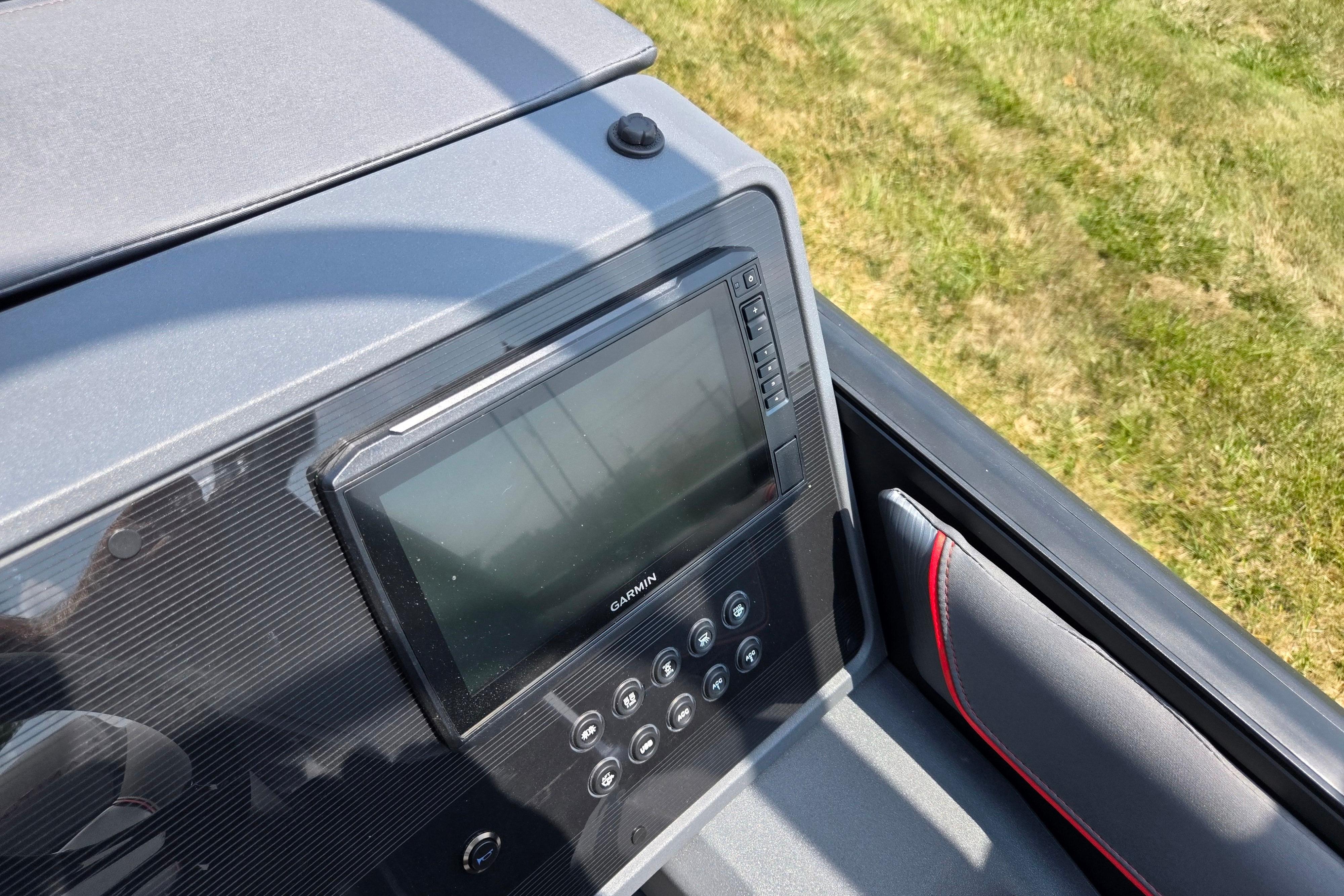 2024 Manitou Explore dashboard featuring a Garmin display and control panel.