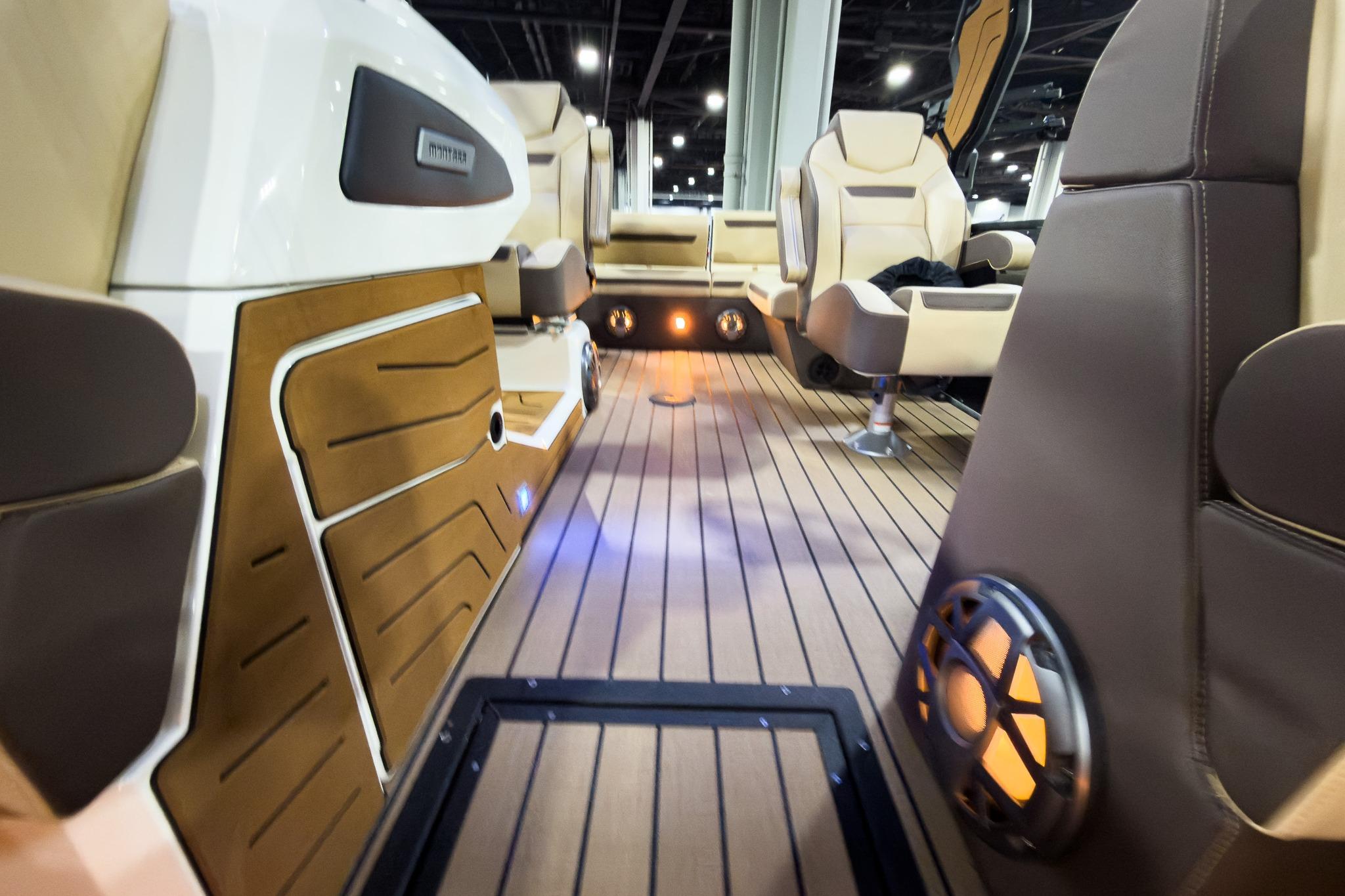 Luxurious interior of 2026 Montara Surf Boss EVO SLDH 25' boat with elegant seating.