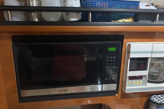 Microwave and appliances in 2005 Rinker Fiesta Vee 320 boat kitchen area.