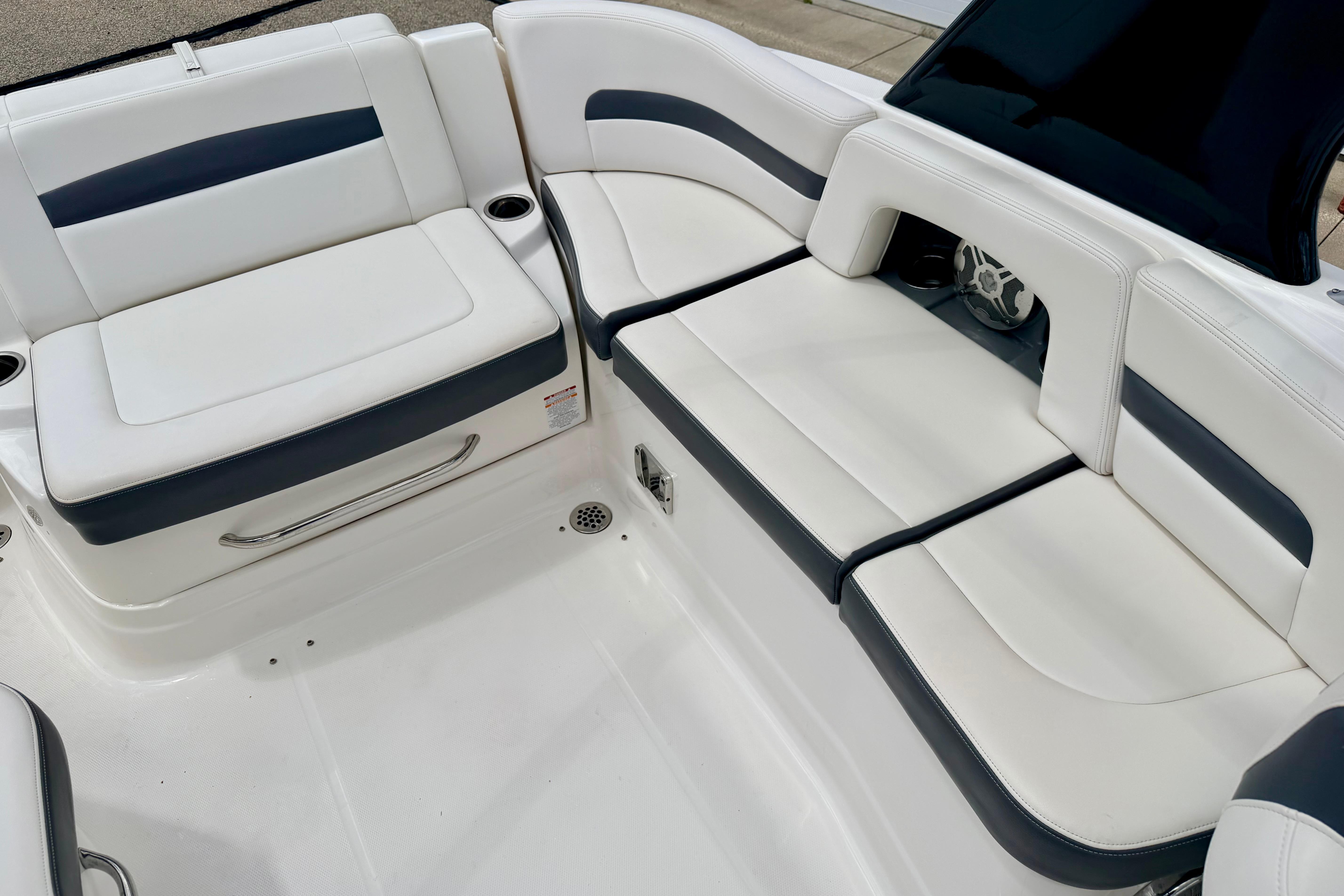 2015 Chaparral Sunesta 264 boat interior with white and gray seating.