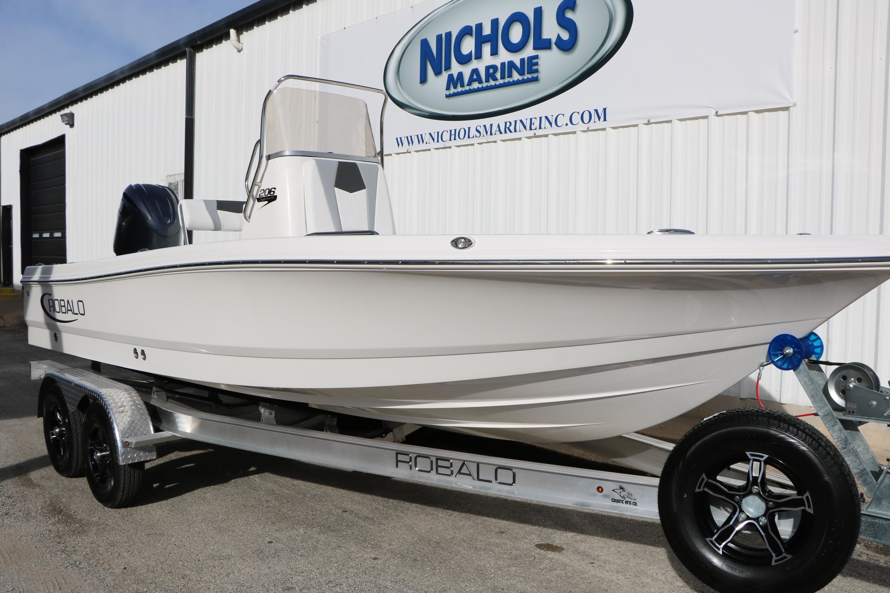 2026 Robalo 206 Cayman boat on trailer at Nichols Marine dealership.