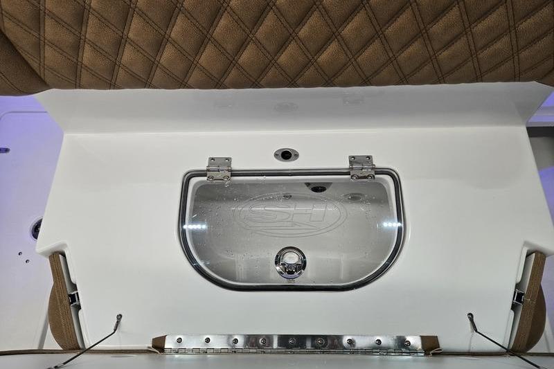 Livewell compartment on 2026 Sea Hunt Ultra 275 Coffin Box boat, featuring a clear lid.