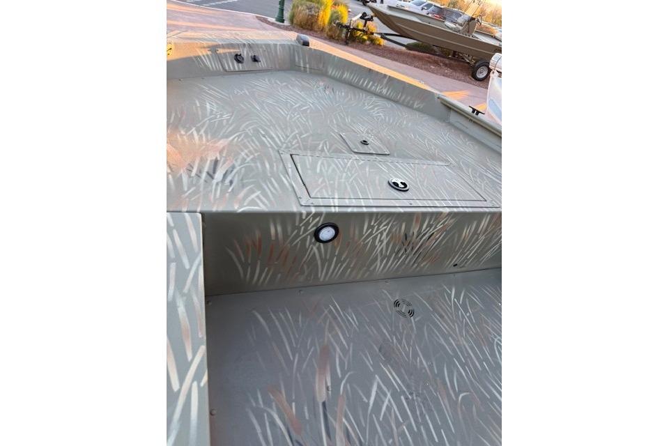 2025 Tracker Grizzly 1654 T Sportsman boat interior with camouflage pattern.