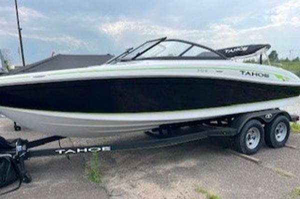 2024 Tahoe 210 Si boat on a trailer, black and white with green accents.