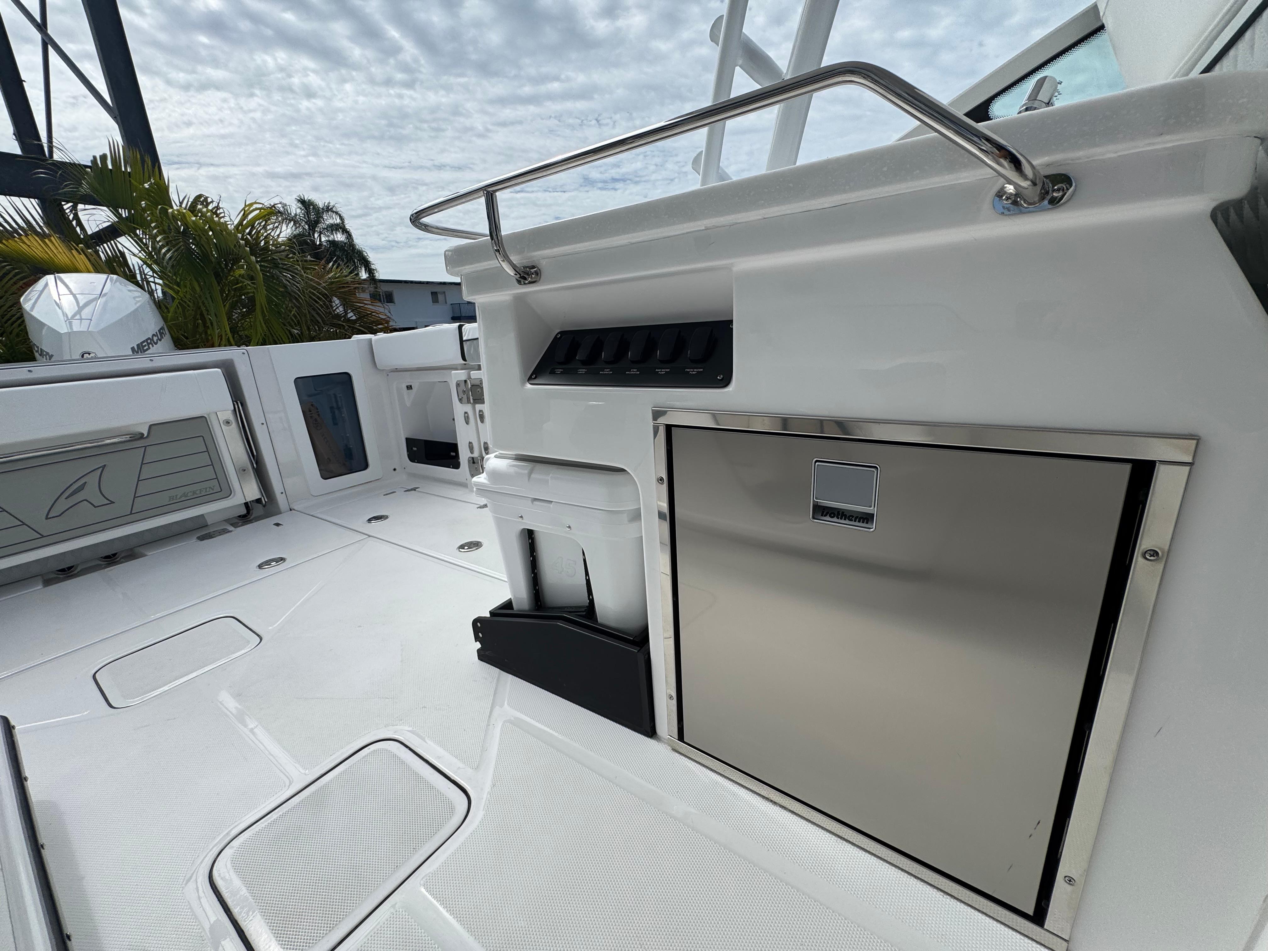 2026 Blackfin 302 DC boat deck with stainless steel features and storage compartments.