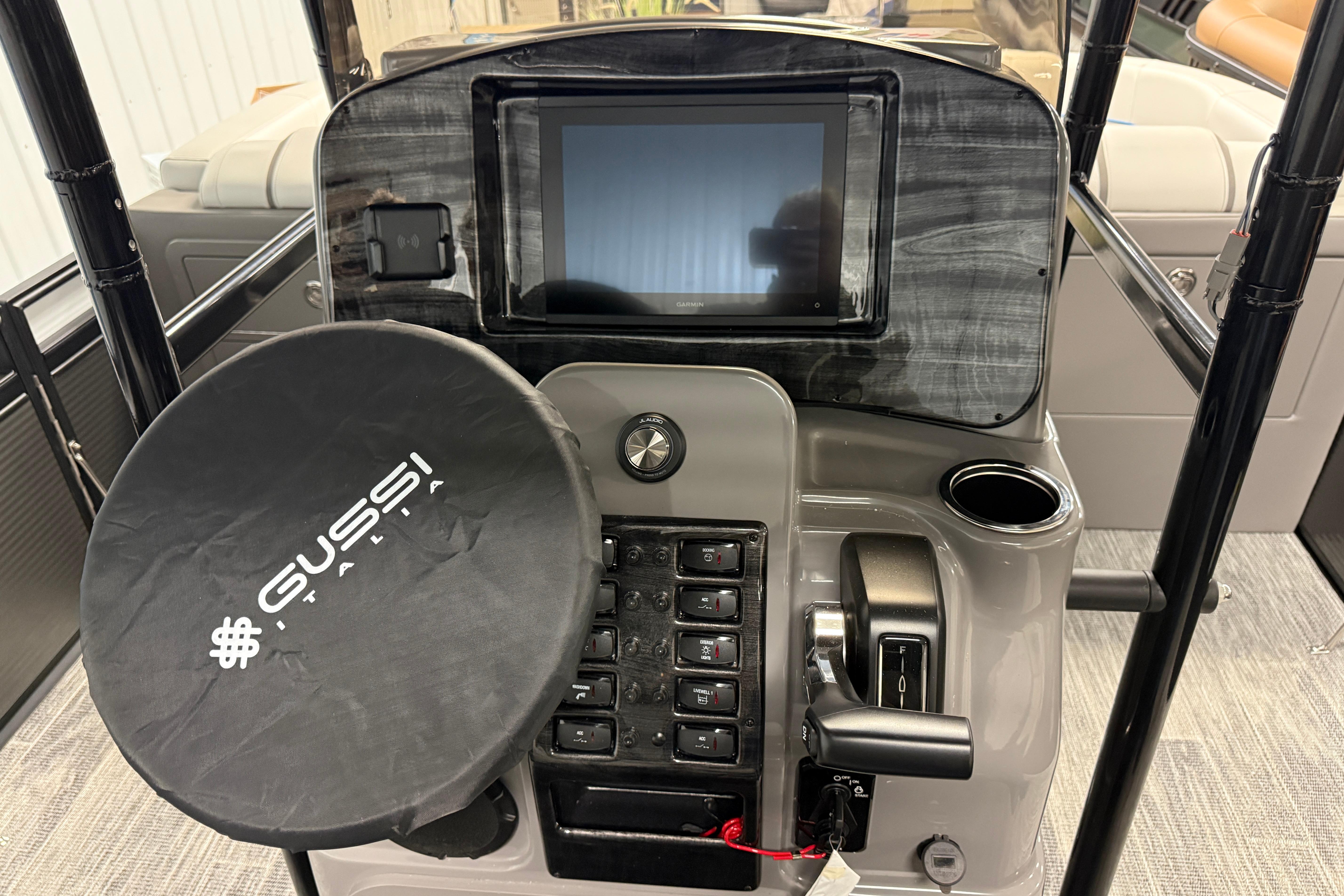 2026 Qwest M-Class 22 Pro Sport boat dashboard with Gussi Italia steering wheel cover.