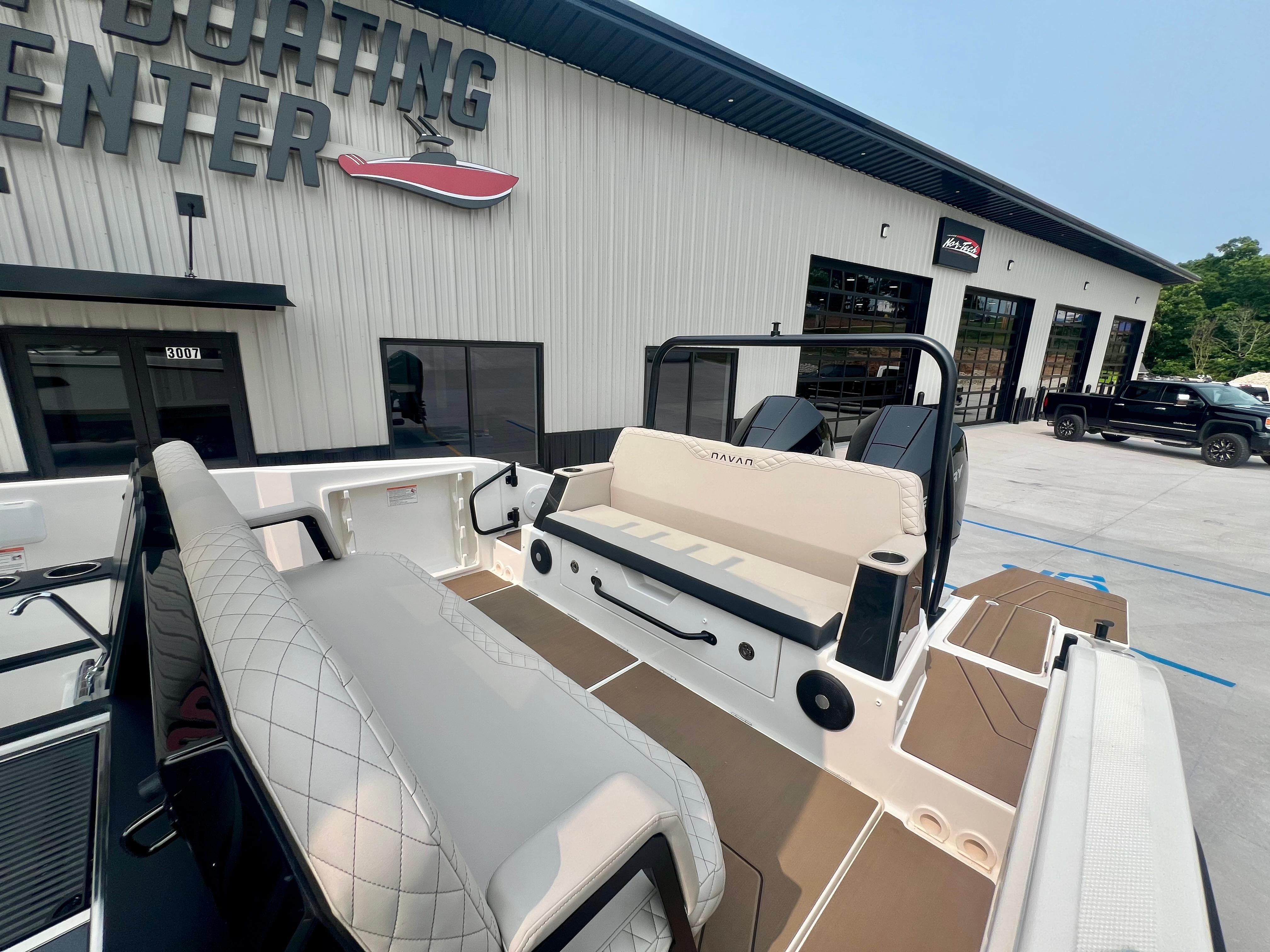 2025 Navan S-30 boat at dealership, showcasing seating and interior design.