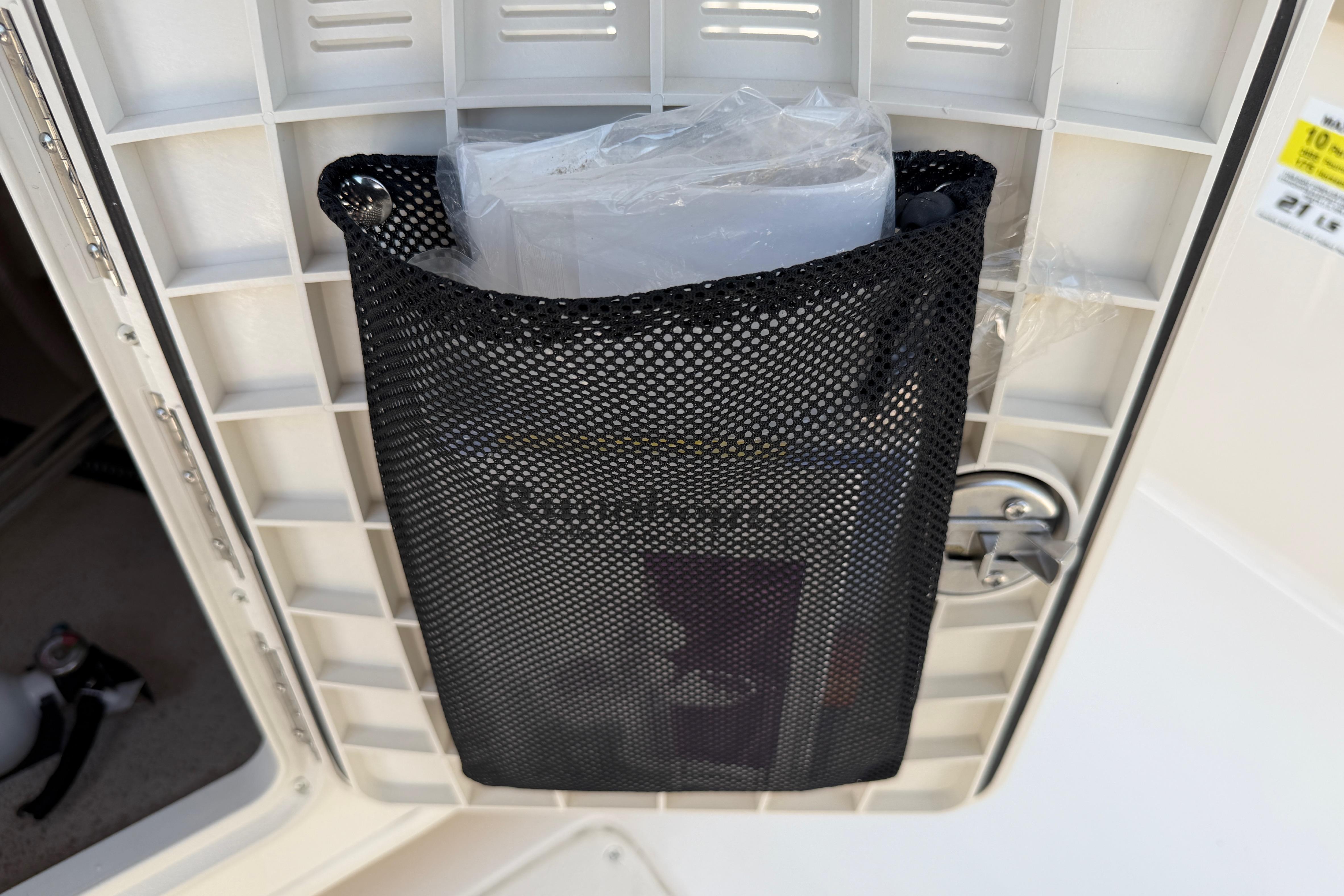 Mesh storage pocket on a 2023 Carolina Skiff 21 LS boat interior.