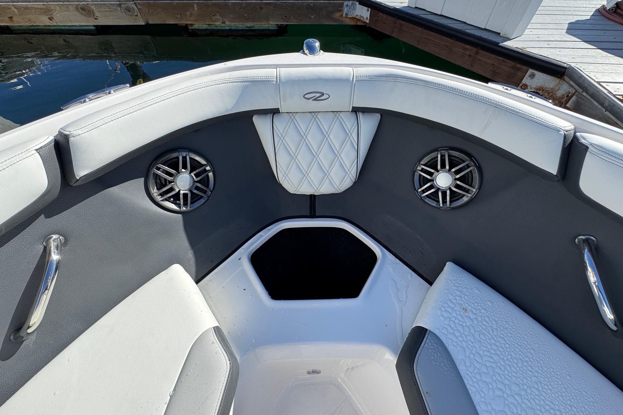 Interior of 2026 Regal 21 OBX boat with speakers and seating.