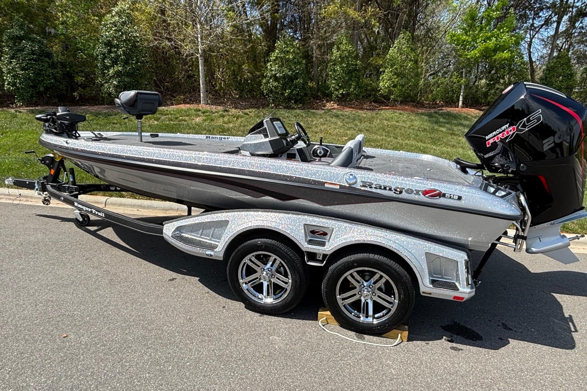 2026 Ranger Z518 Cup-Equipped boat on trailer, parked outdoors, featuring sleek design and powerful engine.