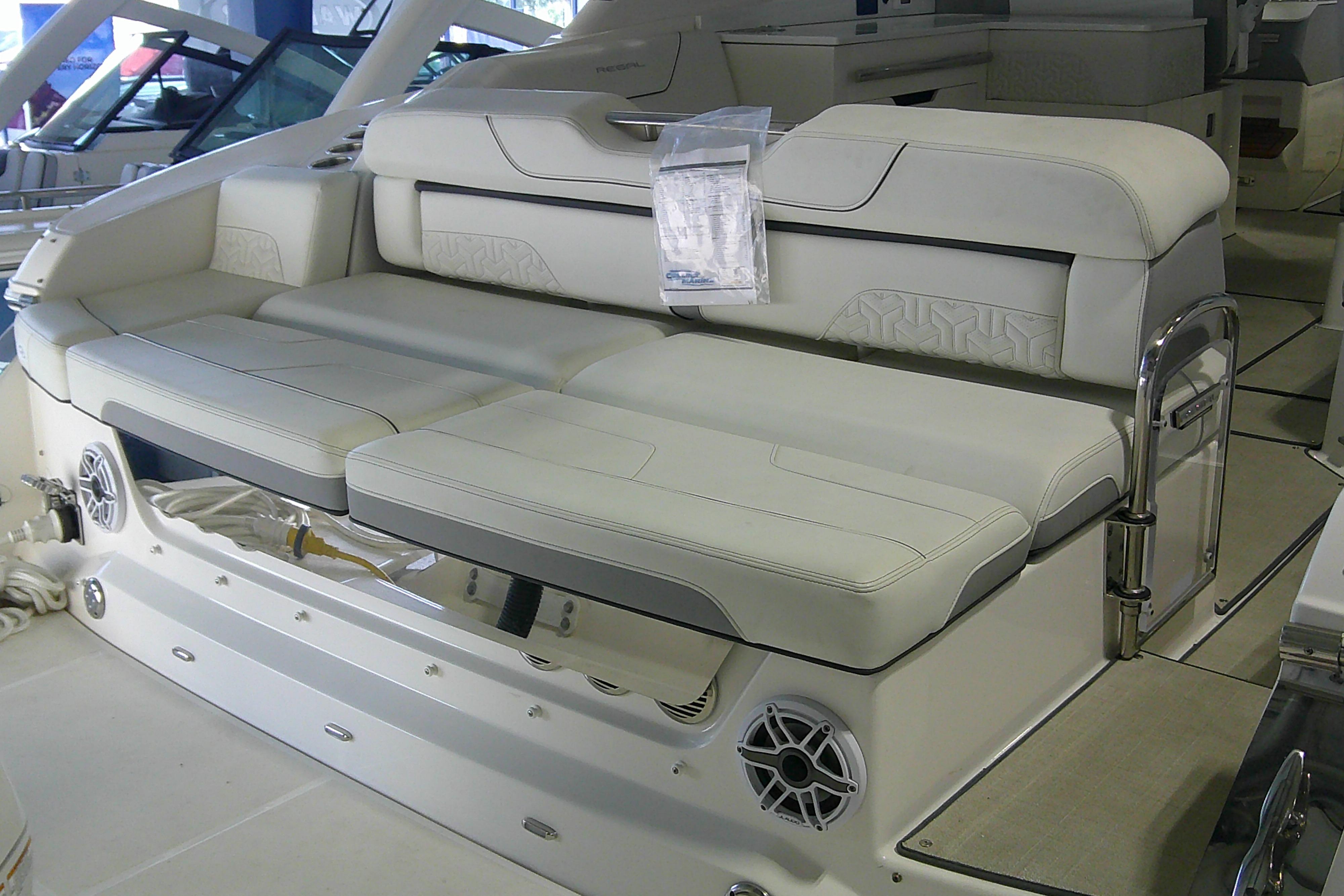 2023 Regal LX36 boat interior with luxurious white seating and modern design.