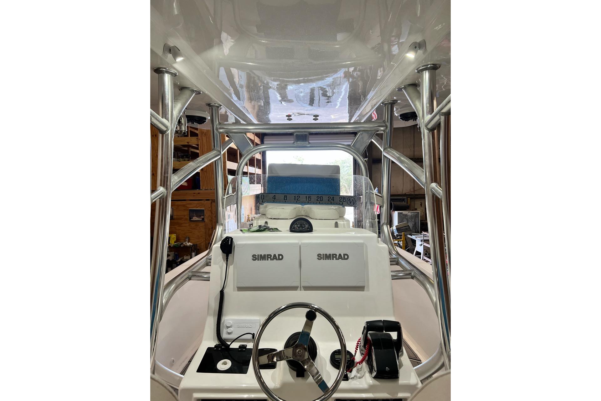 2021 Custom Infusion 34 CC boat cockpit with Simrad navigation system.