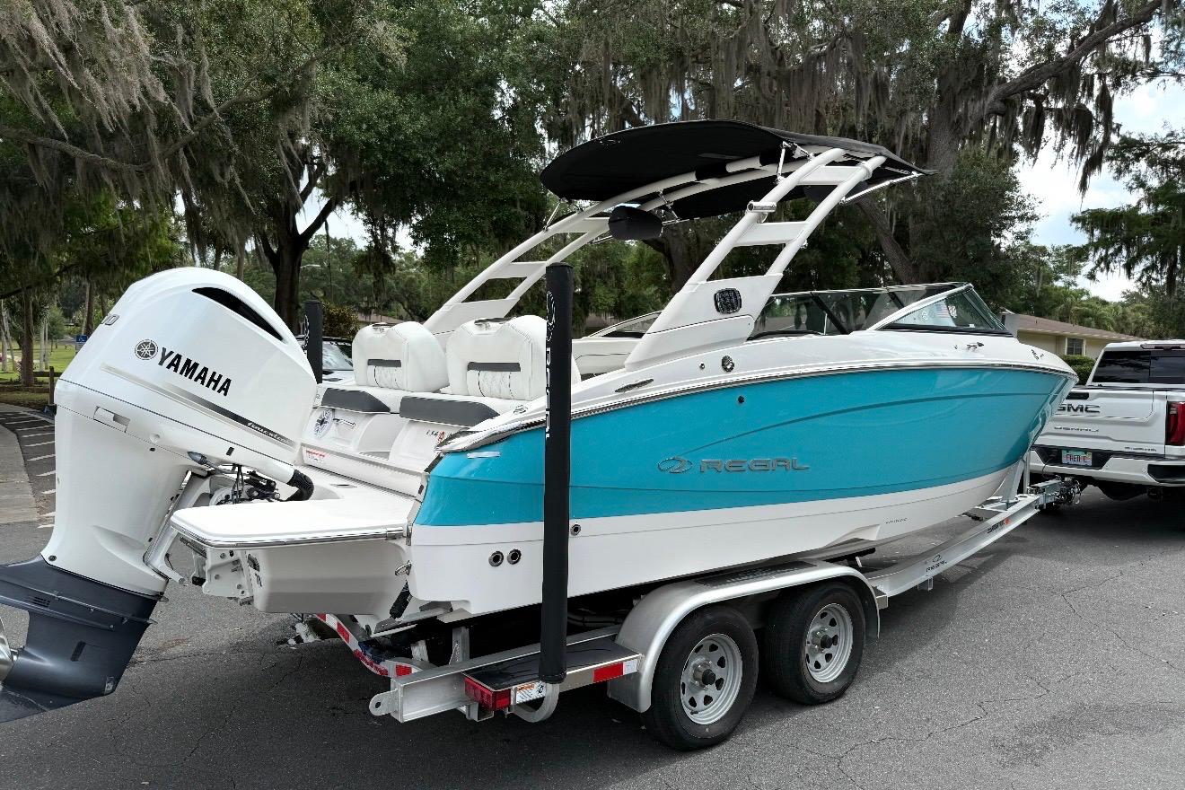 2020 Regal LX4 boat with Yamaha engine on trailer, parked outdoors.
