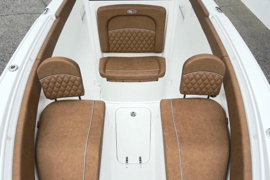 2026 Sea Hunt Ultra 255 SE boat interior with tan cushioned seating.