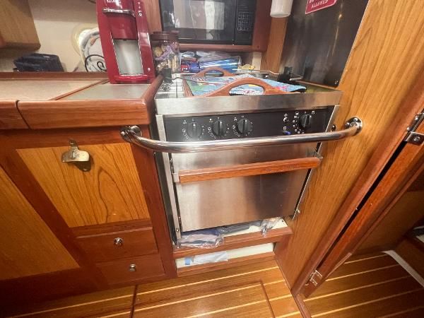 Interior view of a 2000 Hunter 410 featuring a stainless steel kitchen.