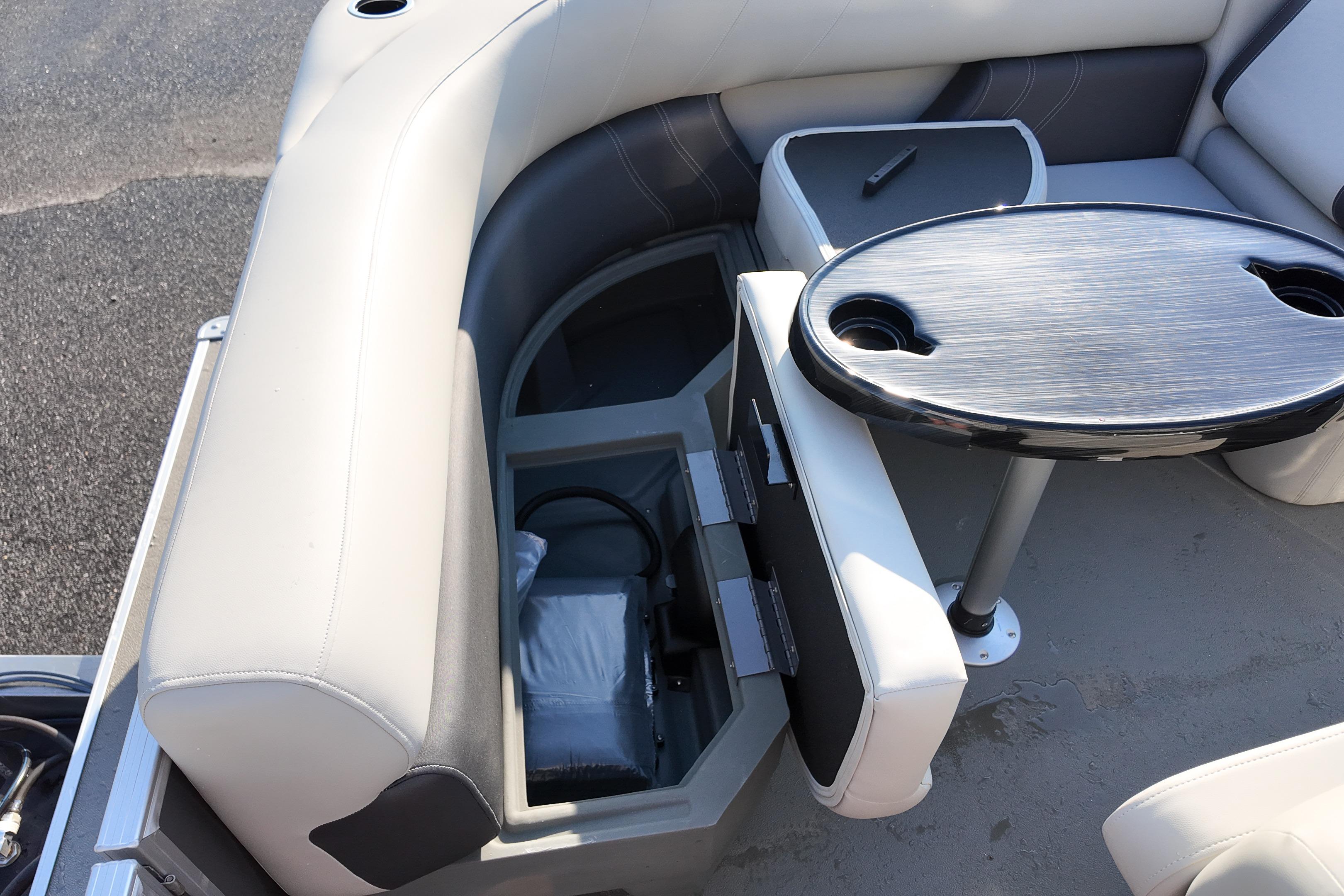 2026 Sylvan Mirage 818 Fish boat interior with seating and storage compartments.