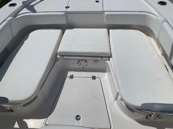 2024 Robalo 266 Cayman boat interior seating area with white cushions.