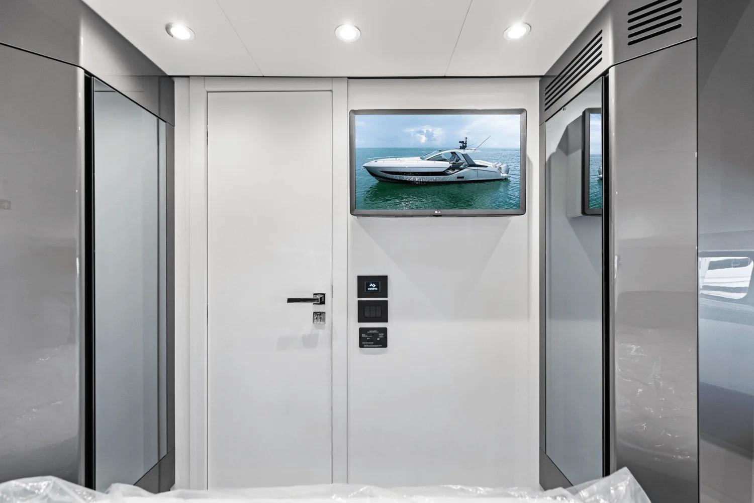 Interior of 2026 Azimut Verve 48 yacht with modern design and wall-mounted TV.