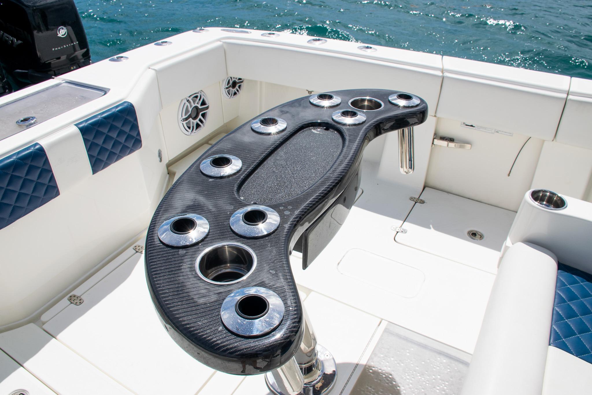 2022 SeaVee 390Z boat with sleek cockpit and cup holders on deck.