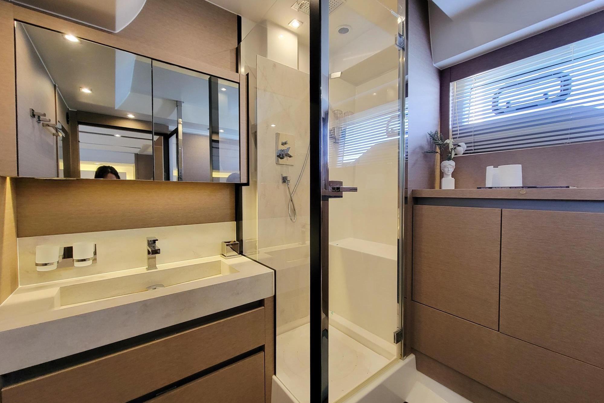 Luxurious bathroom in 2019 Prestiage 630 yacht, featuring modern fixtures and elegant design.