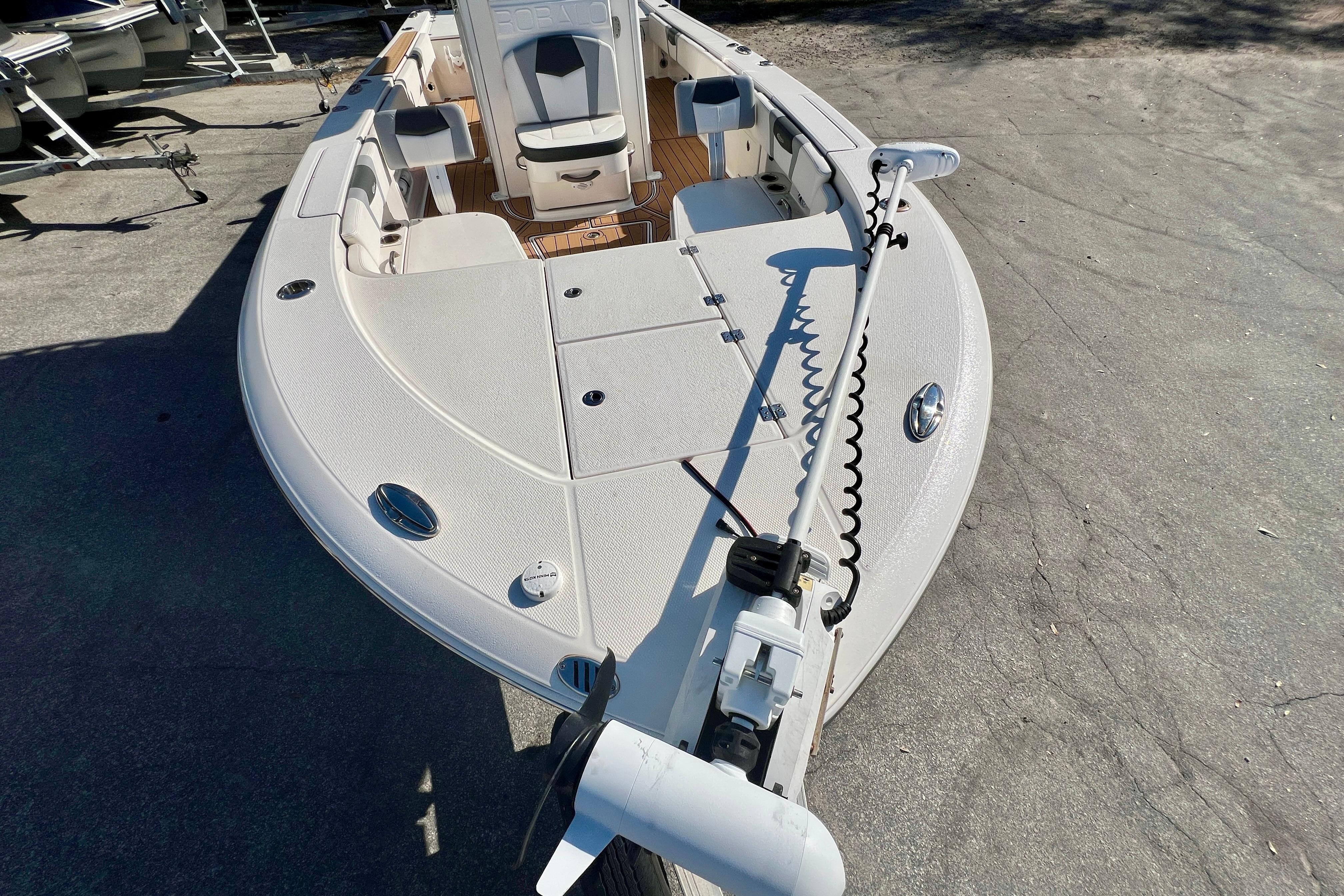 2023 Robalo 266 Cayman boat, front deck view with seating and equipment.