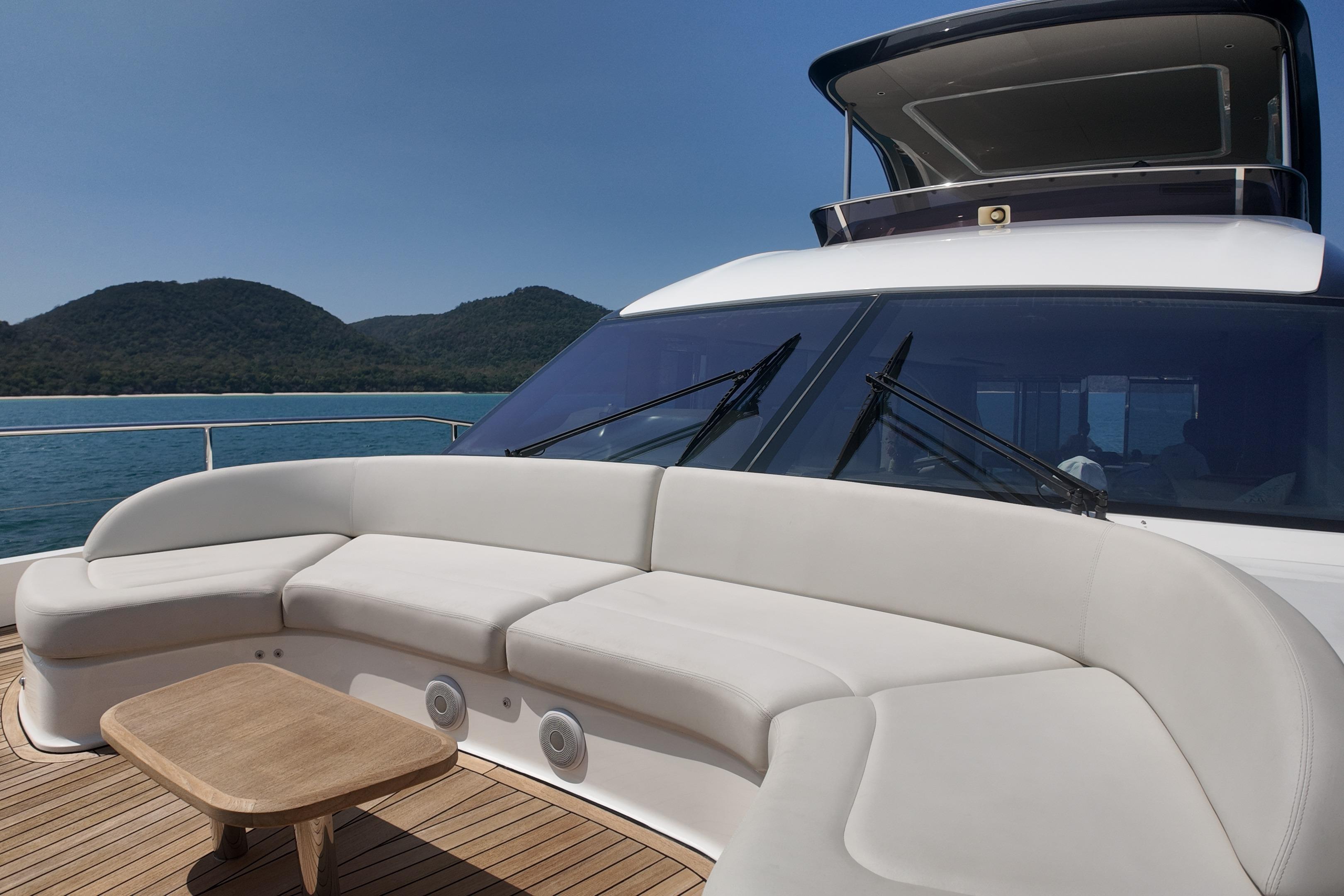 Luxurious 2023 Princess Y72 yacht deck with elegant seating and scenic ocean view.