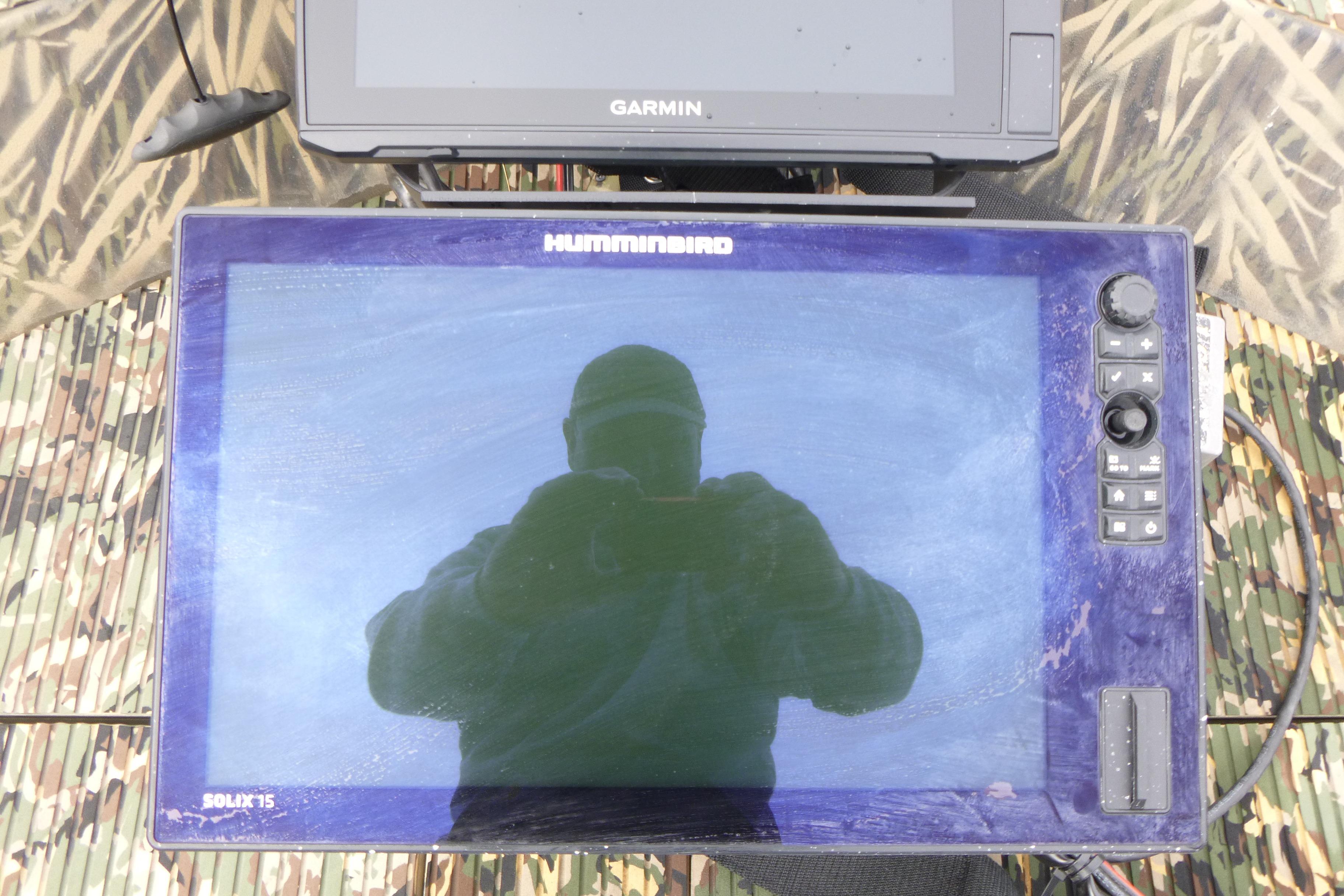 Humminbird Solix 15 fish finder on 2024 Lowe Roughneck 2070 boat, with Garmin device above.