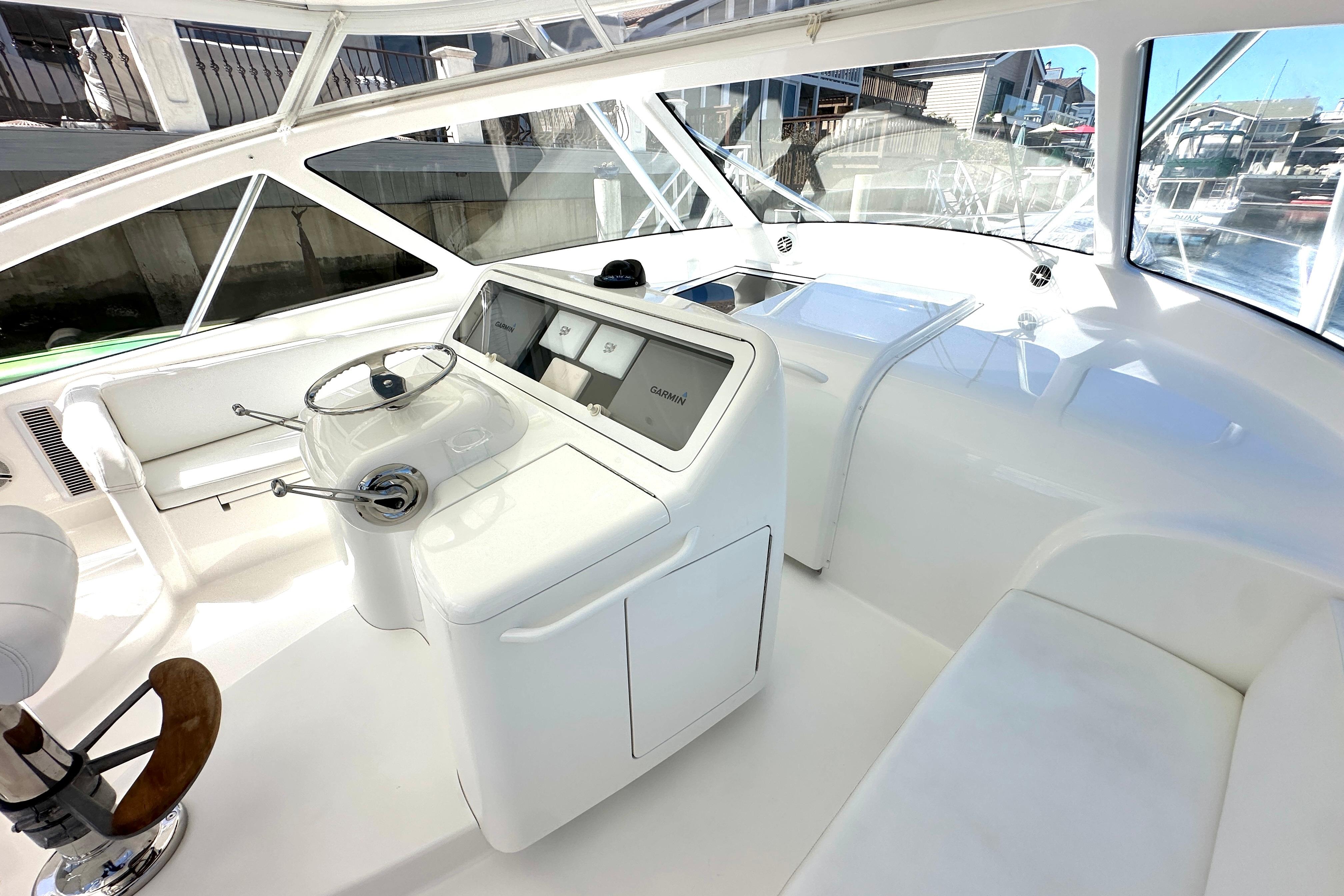 2012 Viking 42 Open yacht helm with modern controls and panoramic windows.