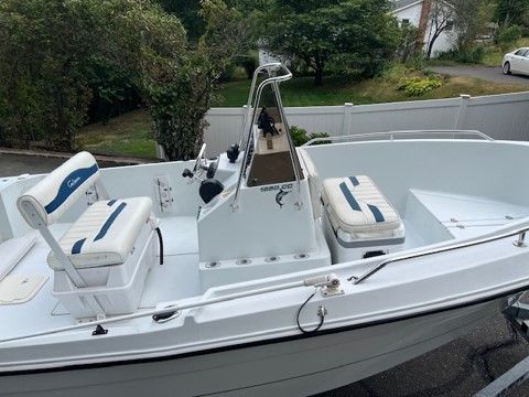 Pro Sports 1850 boat from 2000, white, on trailer.