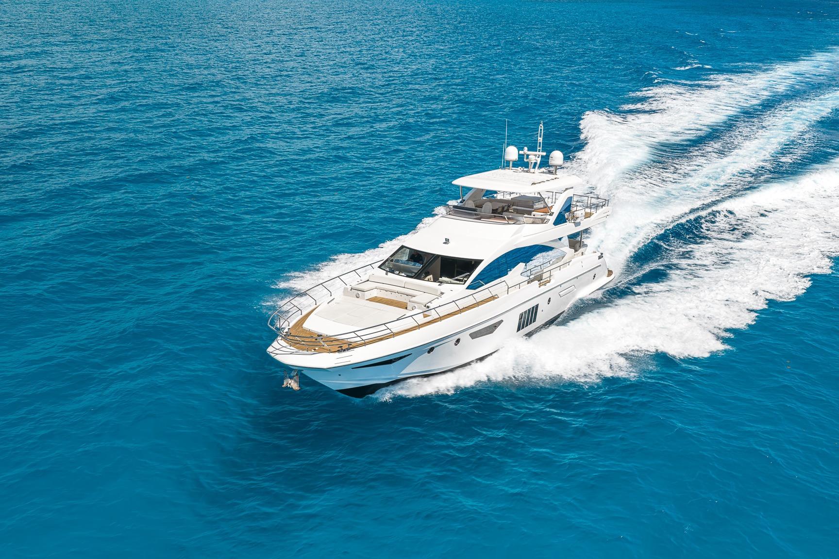 Luxurious 2015 Azimut 80 yacht cruising on vibrant blue ocean waters.