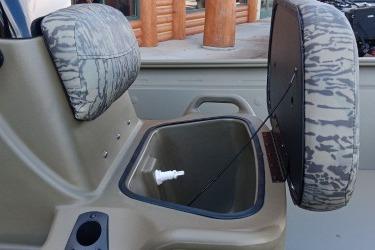 2026 Tracker Grizzly 1860 CC boat interior with open storage compartment.