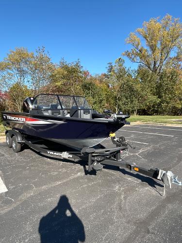 2025 Tracker Targa V-19 WT boat on trailer in sunny parking lot.