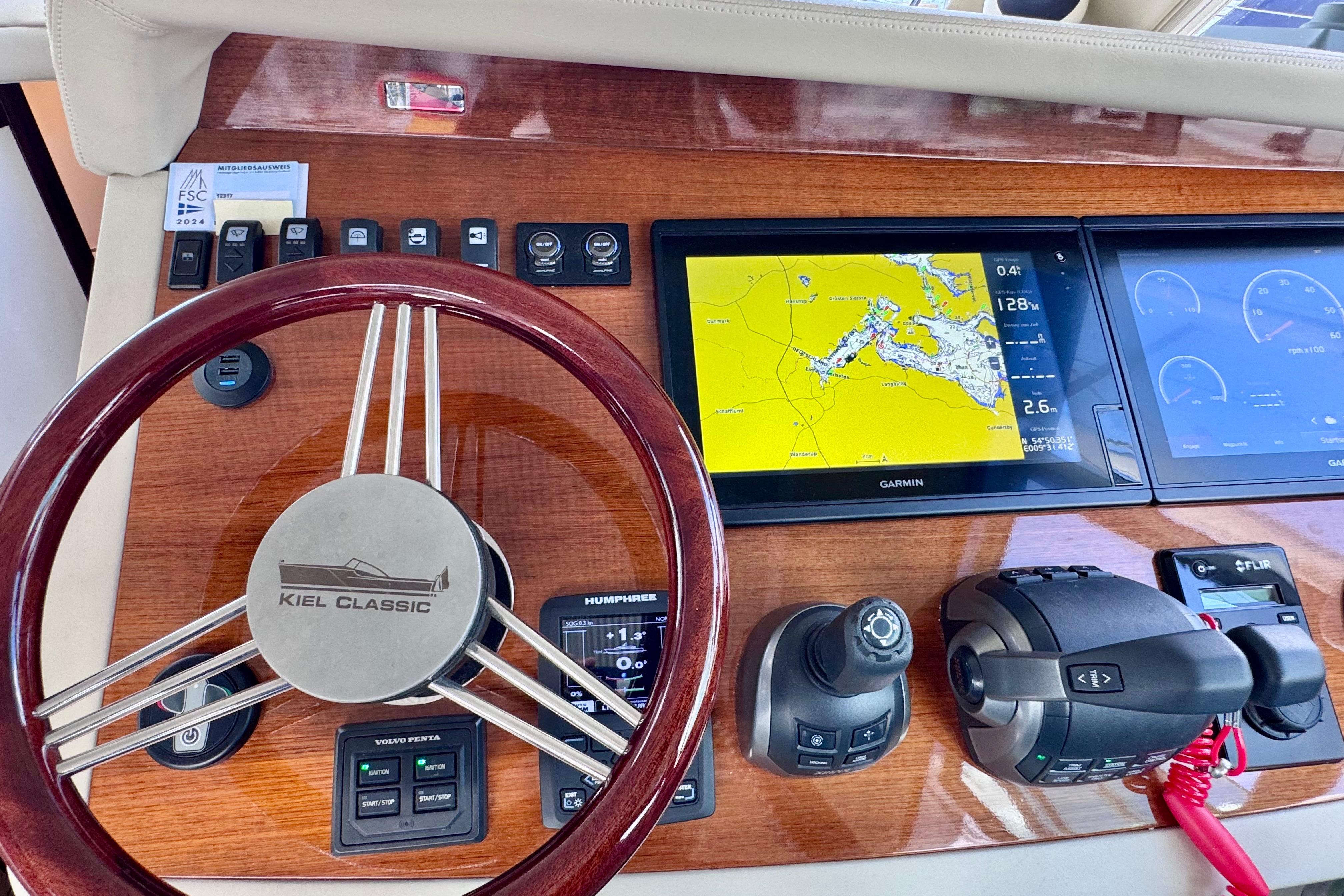 Steering wheel and navigation controls of a 2018 Kiel Classic 44 HT yacht.