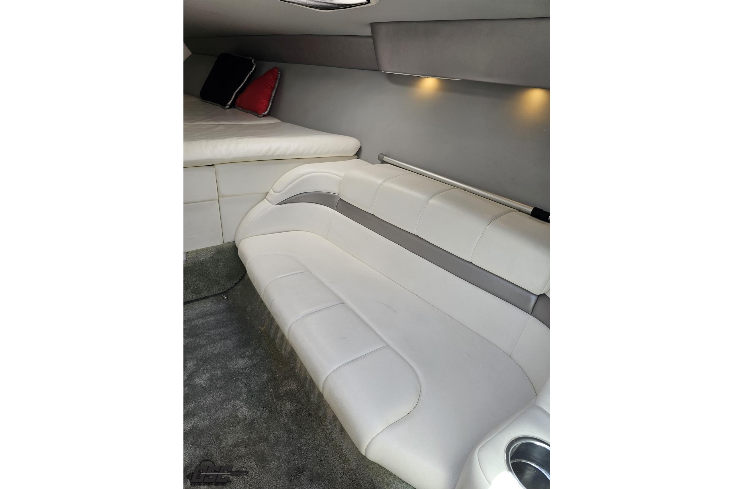 Interior of 2005 Formula 271 FASTech boat with white seating and ambient lighting.