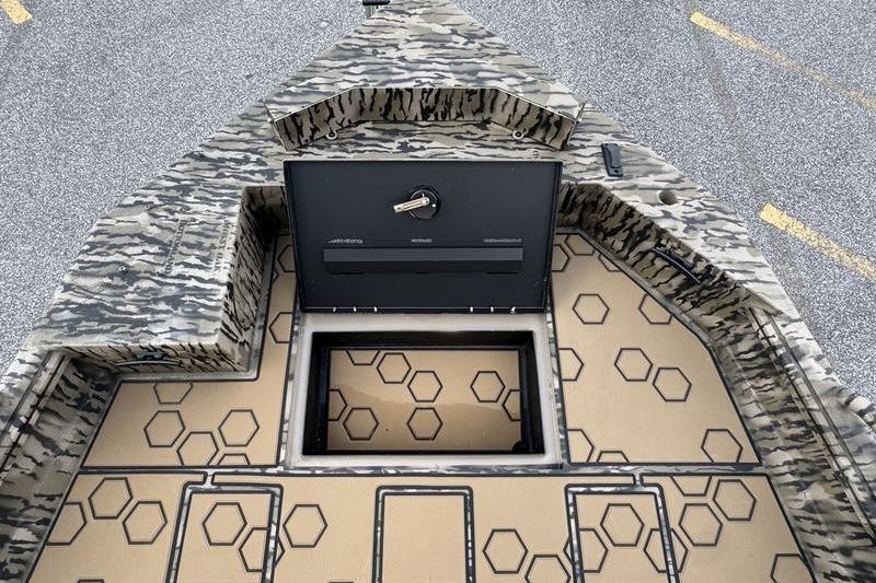 2026 Excel 183 Tomahawk boat interior with camo design and hexagonal pattern flooring.