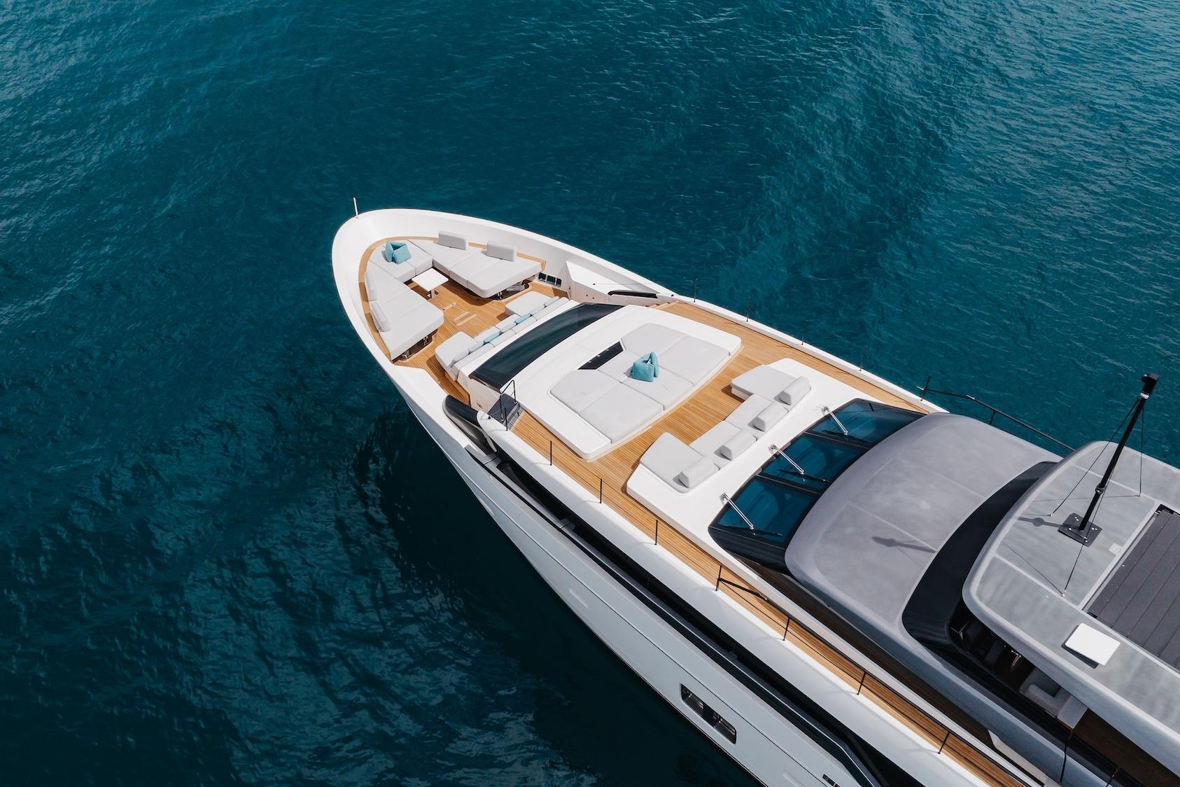 Luxurious 2020 Sanlorenzo SLA120A yacht on clear blue water, featuring elegant deck seating.