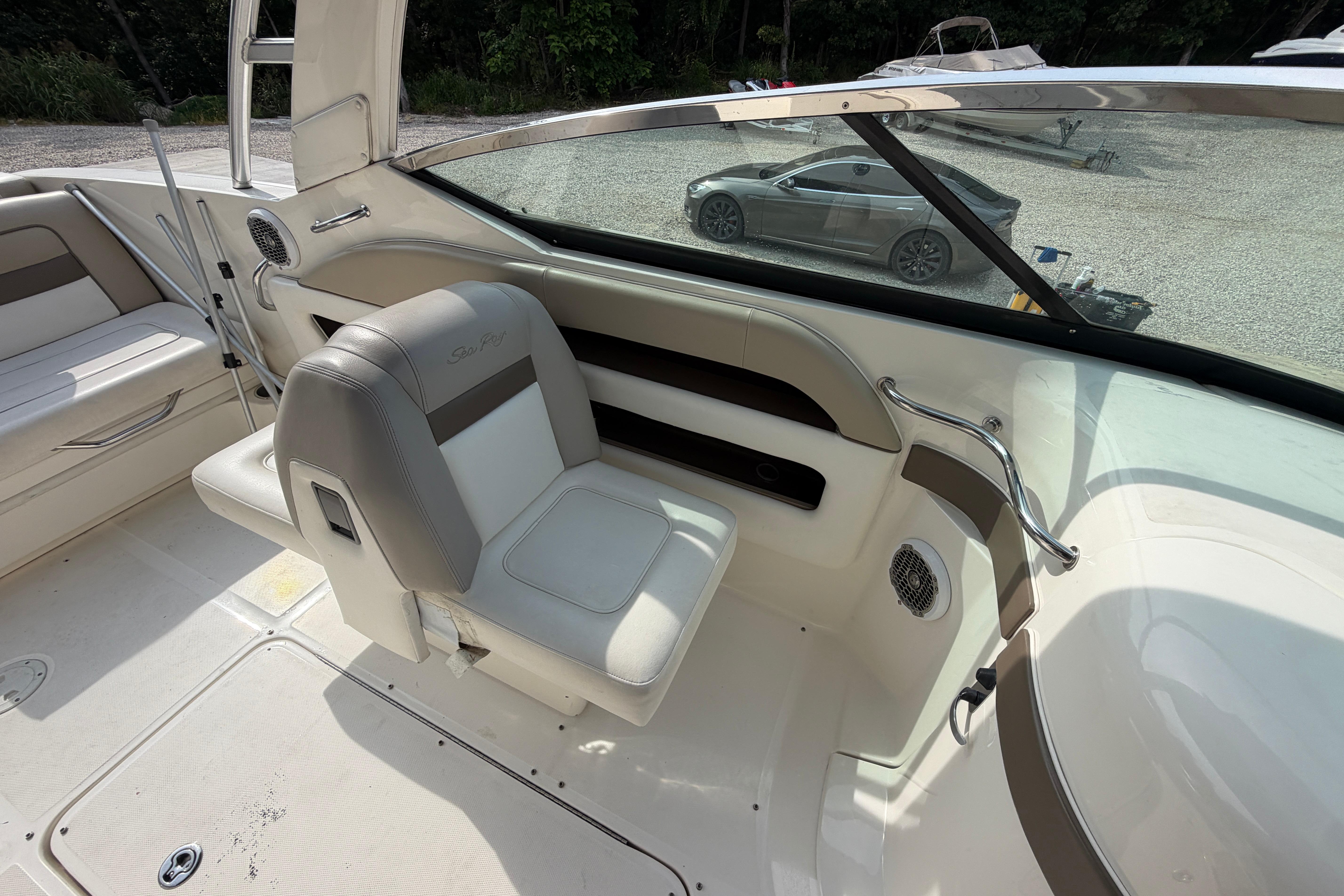 Interior of a 2013 Sea Ray 300 SLX boat with seating and dashboard details.