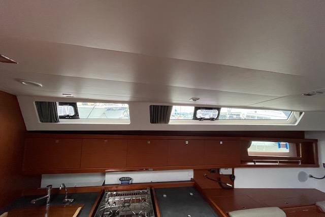 Interior of 2018 Beneteau Oceanis 45 yacht, featuring a modern kitchen area.