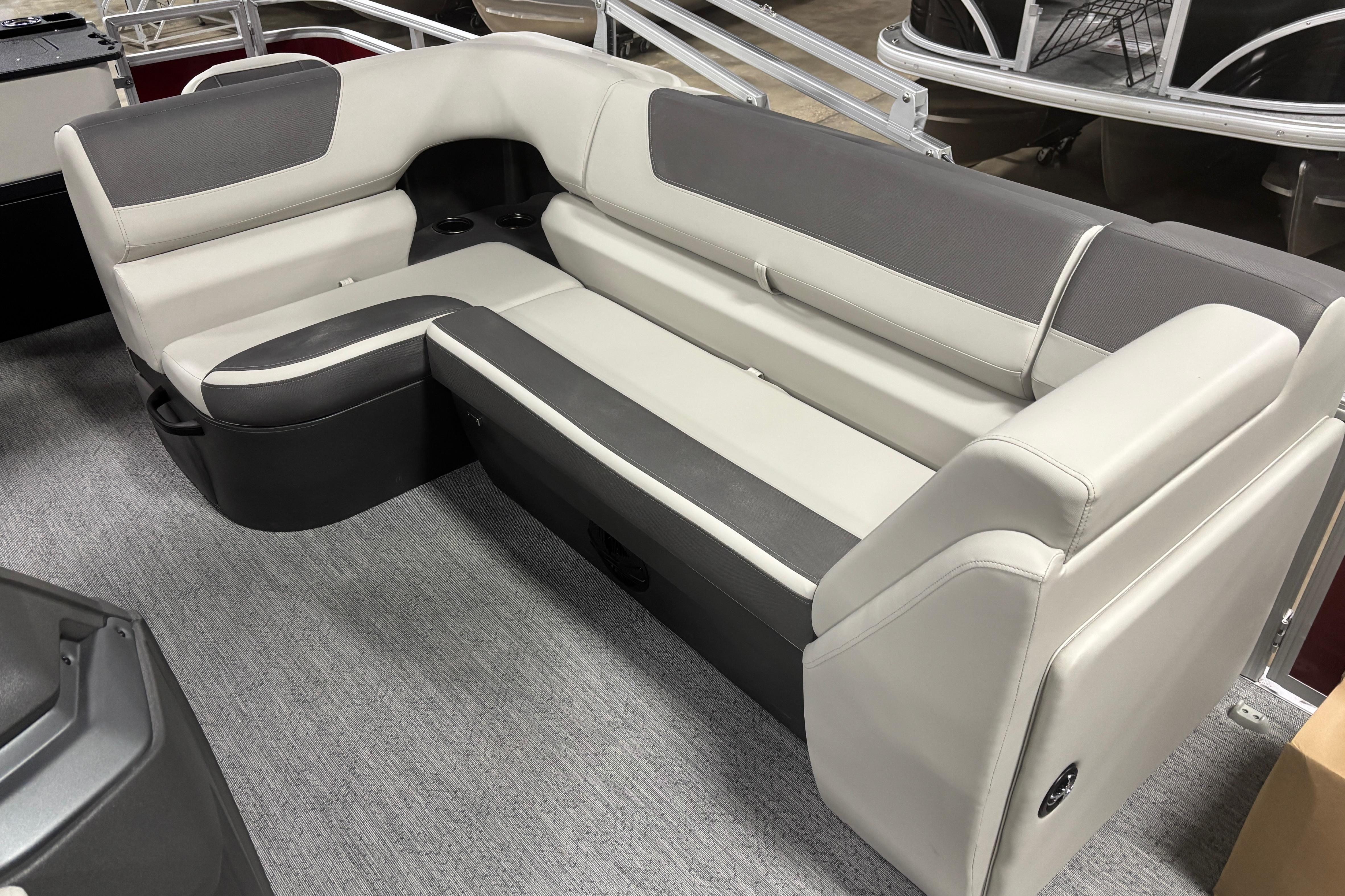 2026 Sun Tracker Fishin' Barge 22 DLX interior seating, featuring gray and white upholstery.
