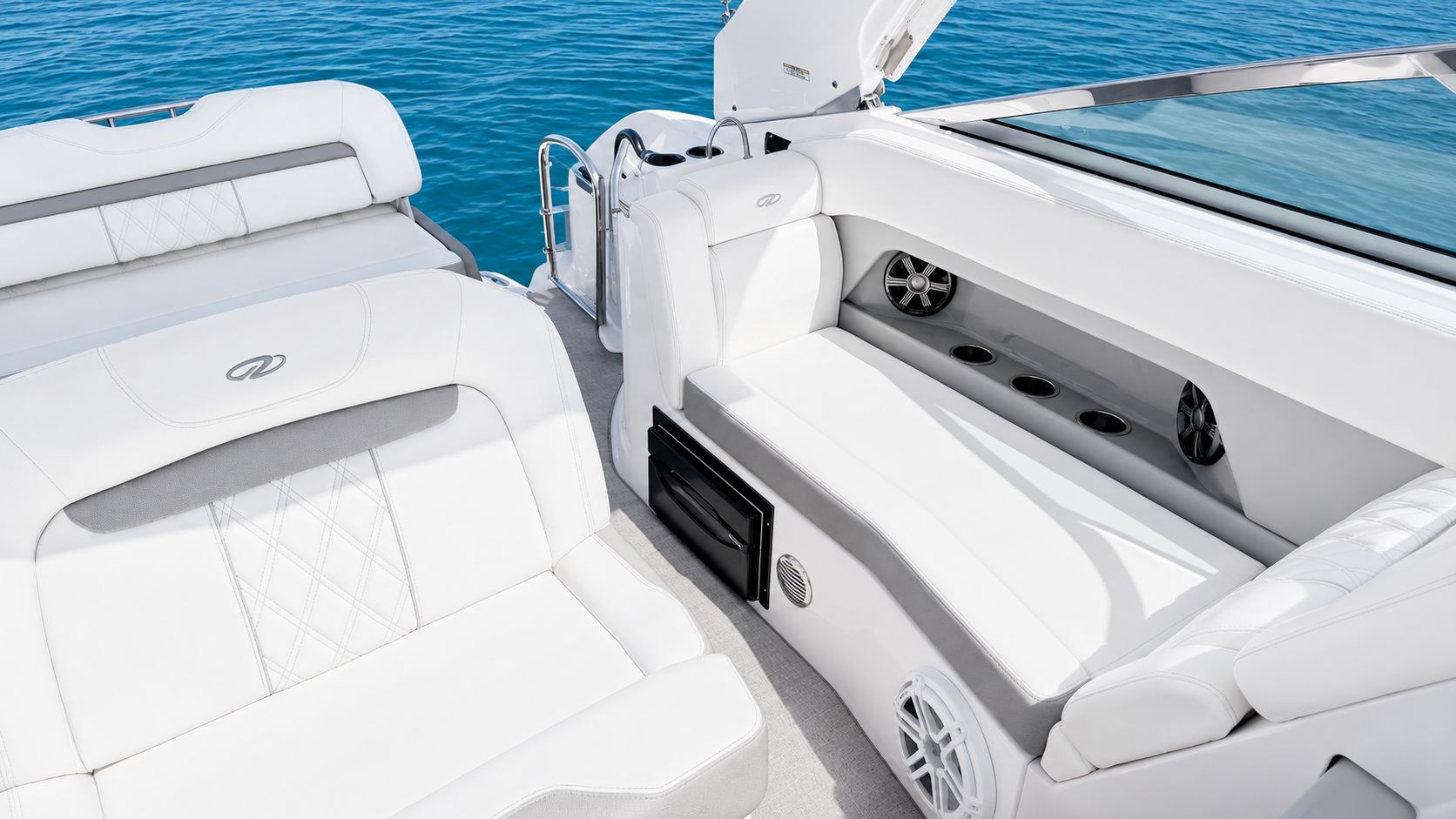 The image shows the luxurious cockpit of a 2020 Regal 28 Express boat on calm water.